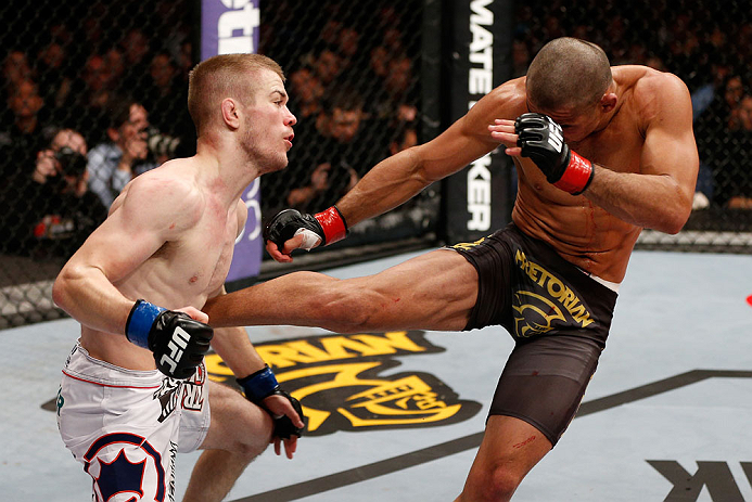 LONDON, ENGLAND - FEBRUARY 16: (R-L) Renan Barao kicks Michael McDonald in their interim bantamweight title fight during the UFC on Fuel TV event on February 16, 2013 at Wembley Arena in London, England. (Photo by Josh Hedges/Zuffa LLC/Zuffa LLC via Getty Images)