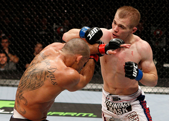 LONDON, ENGLAND - FEBRUARY 16: (R-L) Michael McDonald punches Renan Barao in their interim bantamweight title fight during the UFC on Fuel TV event on February 16, 2013 at Wembley Arena in London, England. (Photo by Josh Hedges/Zuffa LLC/Zuffa LLC via Getty Images)