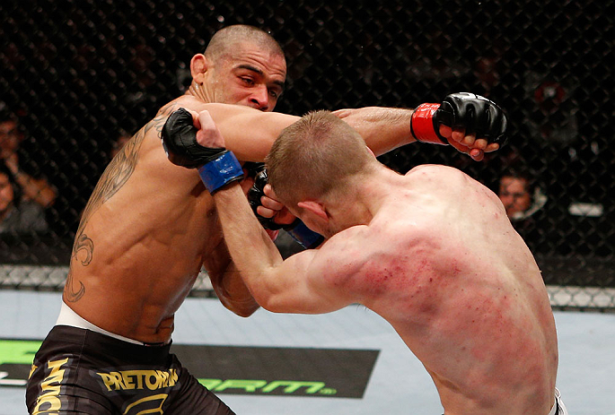 LONDON, ENGLAND - FEBRUARY 16: (L-R) Renan Barao punches Michael McDonald in their interim bantamweight title fight during the UFC on Fuel TV event on February 16, 2013 at Wembley Arena in London, England. (Photo by Josh Hedges/Zuffa LLC/Zuffa LLC via Getty Images)