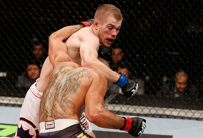 LONDON, ENGLAND - FEBRUARY 16: (L-R) Michael McDonald punches Renan Barao in their interim bantamweight title fight during the UFC on Fuel TV event on February 16, 2013 at Wembley Arena in London, England. (Photo by Josh Hedges/Zuffa LLC/Zuffa LLC via Getty Images)