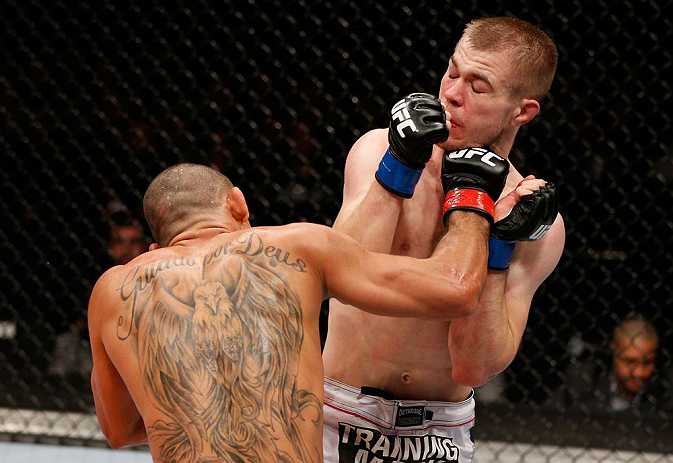 LONDON, ENGLAND - FEBRUARY 16: (L-R) Renan Barao punches Michael McDonald in their interim bantamweight title fight during the UFC on Fuel TV event on February 16, 2013 at Wembley Arena in London, England. (Photo by Josh Hedges/Zuffa LLC/Zuffa LLC via Getty Images)