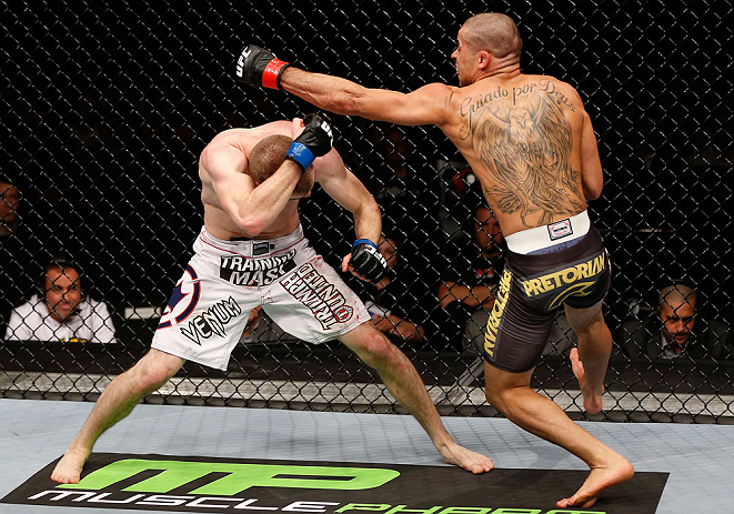 LONDON, ENGLAND - FEBRUARY 16: (R-L) Renan Barao punches Michael McDonald in their interim bantamweight title fight during the UFC on Fuel TV event on February 16, 2013 at Wembley Arena in London, England. (Photo by Josh Hedges/Zuffa LLC/Zuffa LLC via Getty Images)