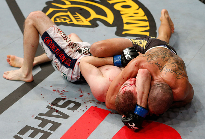 LONDON, ENGLAND - FEBRUARY 16: (R-L) Renan Barao secures an arm triangle choke submission to defeat Michael McDonald in their interim bantamweight title fight during the UFC on Fuel TV event on February 16, 2013 at Wembley Arena in London, England. (Photo by Josh Hedges/Zuffa LLC/Zuffa LLC via Getty Images)