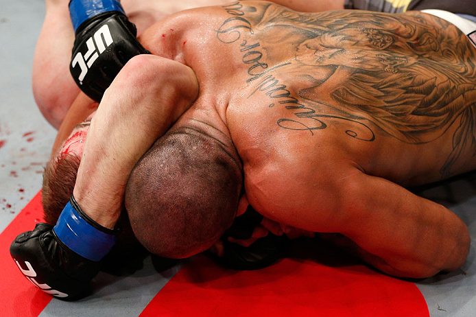 LONDON, ENGLAND - FEBRUARY 16: (R-L) Renan Barao secures an arm triangle choke submission to defeat Michael McDonald in their interim bantamweight title fight during the UFC on Fuel TV event on February 16, 2013 at Wembley Arena in London, England. (Photo by Josh Hedges/Zuffa LLC/Zuffa LLC via Getty Images)