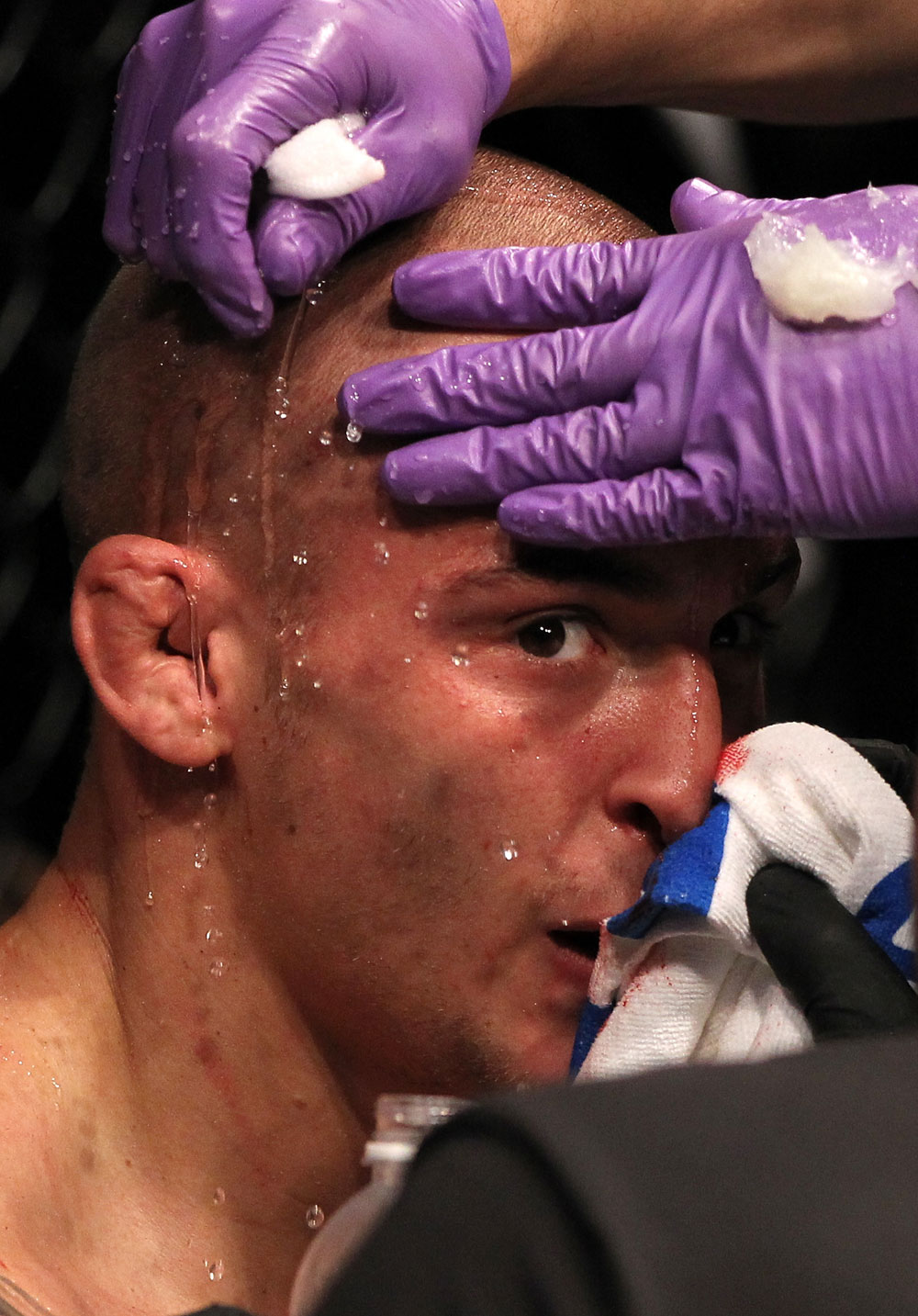 FAIRFAX, VA - MAY 15:  Dustin Poirier rests in his corner between rounds of his fight against "The Korean Zombie" Chan Sung Jung in a featherweight bout during the UFC on Fuel TV event at Patriot Center on May 15, 2012 in Fairfax, Virginia.  (Photo by Josh Hedges/Zuffa LLC/Zuffa LLC via Getty Images)
