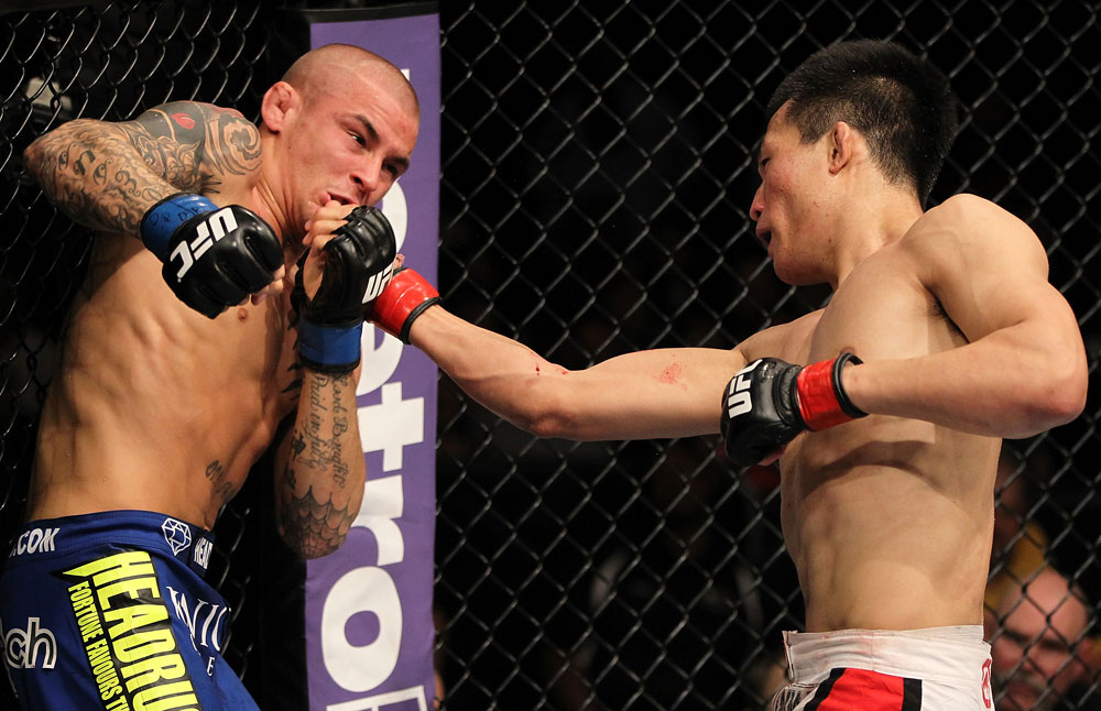 FAIRFAX, VA - MAY 15:  (R-L) "The Korean Zombie" Chan Sung Jung punches Dustin Poirier in a featherweight bout during the UFC on Fuel TV event at Patriot Center on May 15, 2012 in Fairfax, Virginia.  (Photo by Josh Hedges/Zuffa LLC/Zuffa LLC via Getty Images)