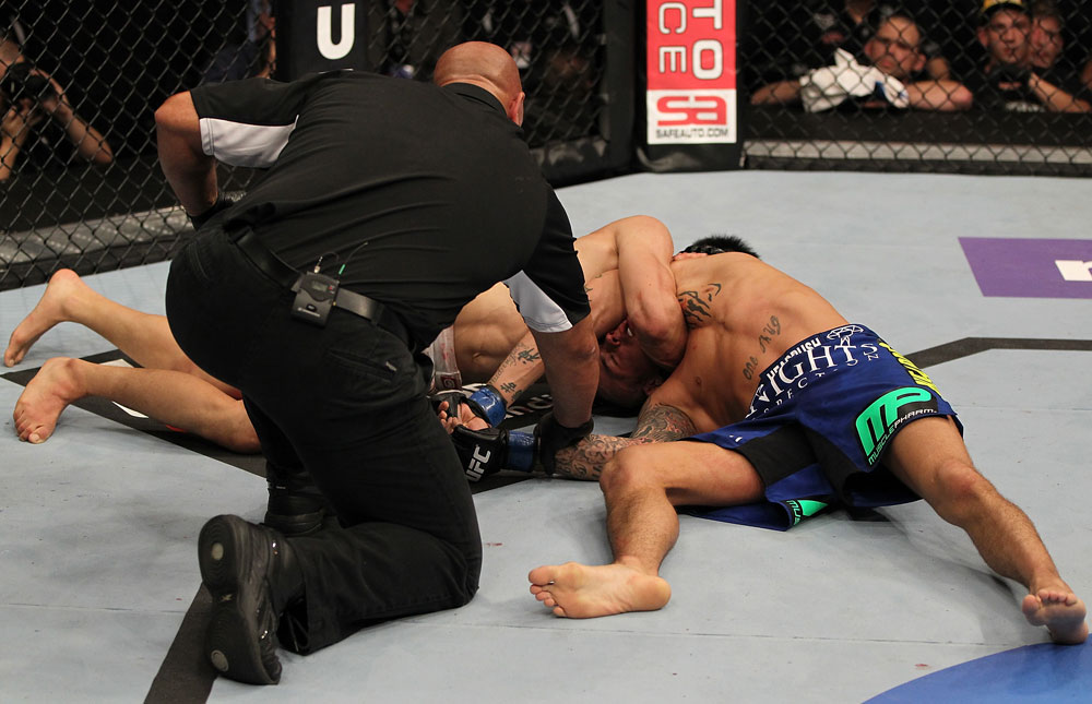 FAIRFAX, VA - MAY 15:  (L-R) "The Korean Zombie" Chan Sung Jung defeats Dustin Poirier with a d'arce choke submission in a featherweight bout during the UFC on Fuel TV event at Patriot Center on May 15, 2012 in Fairfax, Virginia.  (Photo by Josh Hedges/Zuffa LLC/Zuffa LLC via Getty Images)