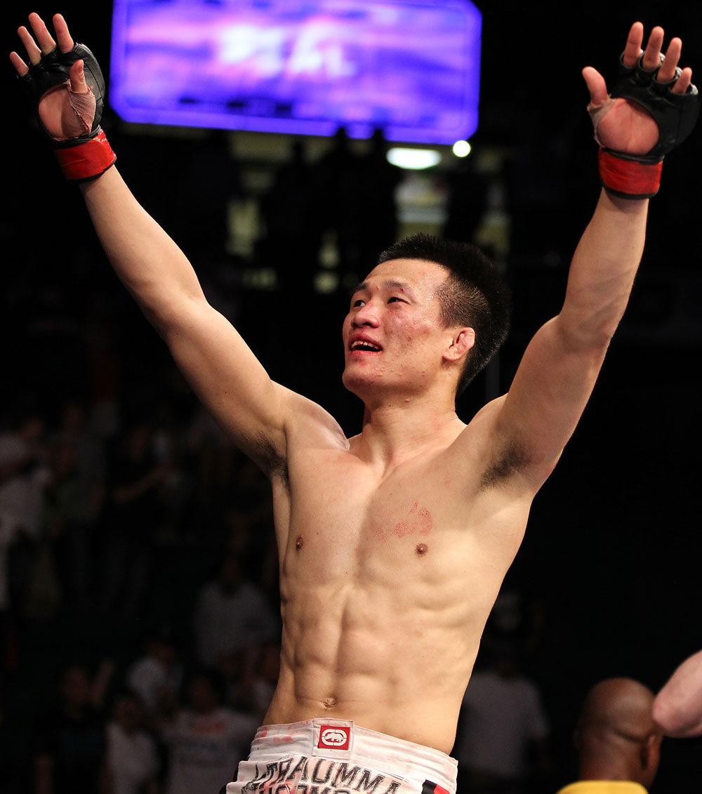 FAIRFAX, VA - MAY 15:  "The Korean Zombie" Chan Sung Jung reacts after defeating Dustin Poirier in a featherweight bout during the UFC on Fuel TV event at Patriot Center on May 15, 2012 in Fairfax, Virginia.  (Photo by Josh Hedges/Zuffa LLC/Zuffa LLC via Getty Images)
