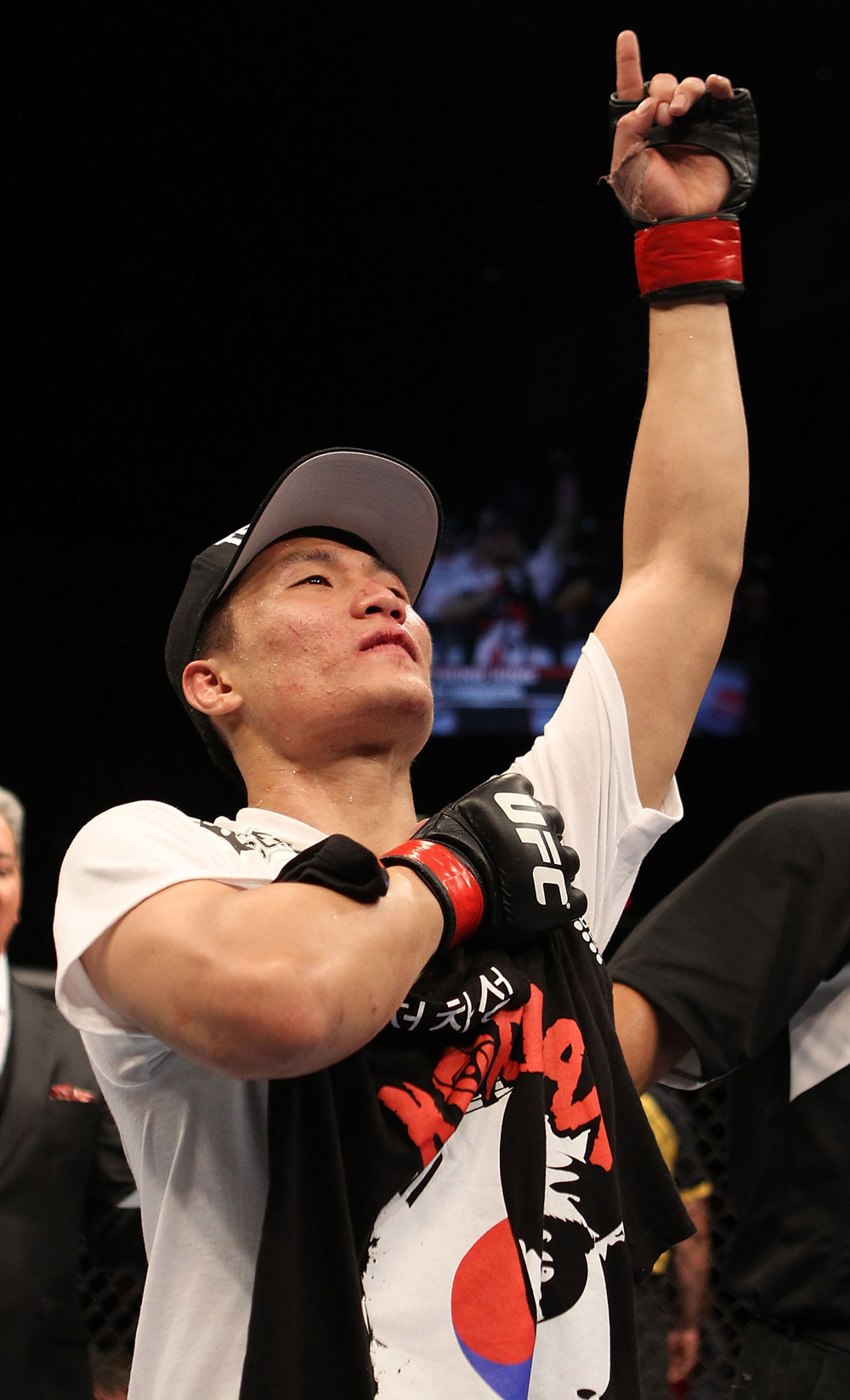 FAIRFAX, VA - MAY 15:  "The Korean Zombie" Chan Sung Jung reacts after defeating Dustin Poirier in a featherweight bout during the UFC on Fuel TV event at Patriot Center on May 15, 2012 in Fairfax, Virginia.  (Photo by Josh Hedges/Zuffa LLC/Zuffa LLC via Getty Images)