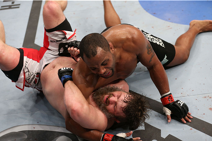 HOUSTON, TEXAS - OCTOBER 19:  (R-L) Daniel Cormier takes down Roy 'Big Country' Nelson in their UFC heavyweight bout at the Toyota Center on October 19, 2013 in Houston, Texas. (Photo by Nick Laham/Zuffa LLC/Zuffa LLC via Getty Images)