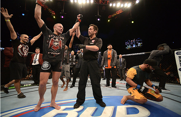 LAS VEGAS, NV - NOVEMBER 16:  Georges St-Pierre (left) is declared the winner over Johny Hendricks (right) in their UFC welterweight championship bout during the UFC 167 event inside the MGM Grand Garden Arena on November 16, 2013 in Las Vegas, Nevada. (Photo by Donald Miralle/Zuffa LLC/Zuffa LLC via Getty Images) *** Local Caption *** Georges St-Pierre; Johny Hendricks