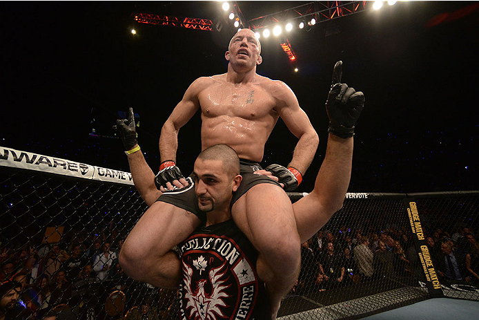 LAS VEGAS, NV - NOVEMBER 16:  Georges St-Pierre (top) reacts to his victory over Johny Hendricks in their UFC welterweight championship bout during the UFC 167 event inside the MGM Grand Garden Arena on November 16, 2013 in Las Vegas, Nevada. (Photo by Donald Miralle/Zuffa LLC/Zuffa LLC via Getty Images) *** Local Caption *** Georges St-Pierre