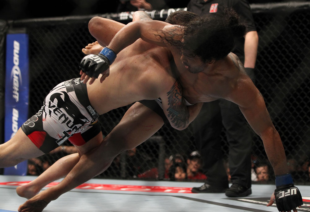 SAITAMA, JAPAN - FEBRUARY 26:  (L-R) Frankie Edgar takes down Benson Henderson during the UFC 144 event at Saitama Super Arena on February 26, 2012 in Saitama, Japan.  (Photo by Josh Hedges/Zuffa LLC/Zuffa LLC via Getty Images) *** Local Caption *** Frankie Edgar; Benson Henderson