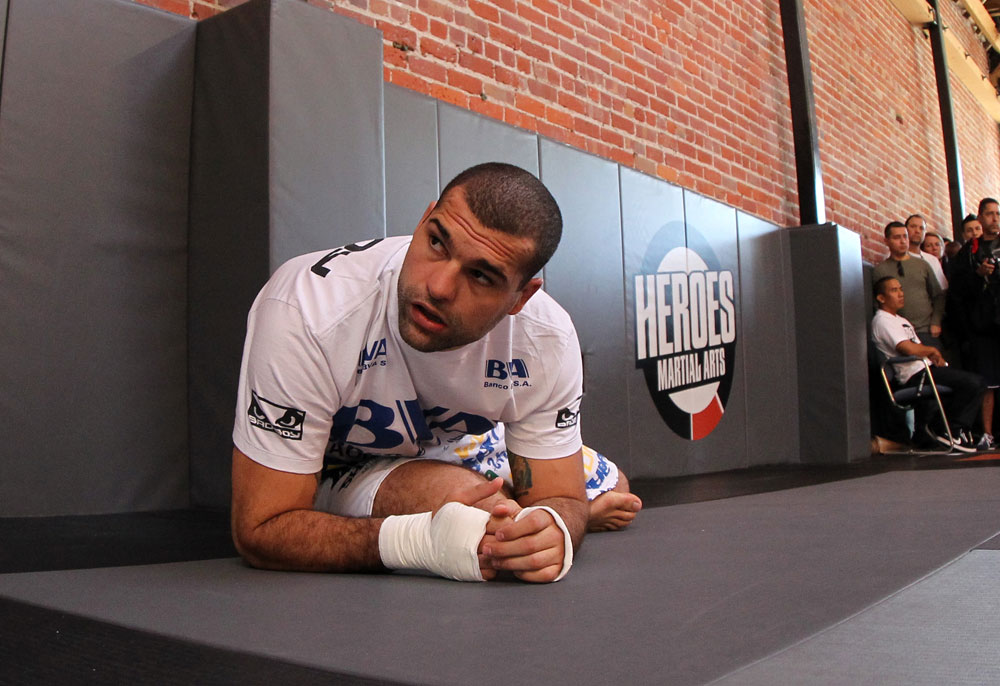 SAN JOSE, CA - NOVEMBER 16:  Mauricio "Shogun" Rua stretches before working out for the fans and media during the UFC 139 open workouts at the Heroes Martial Arts Gym on November 16, 2011 in San Jose, California.  (Photo by Josh Hedges/Zuffa LLC/Zuffa LLC via Getty Images)