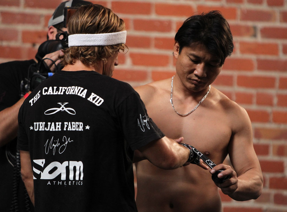 SAN JOSE, CA - NOVEMBER 16:  Urijah Faber has his hands wrapped before working out for the fans and media during the UFC 139 open workouts at the Heroes Martial Arts Gym on November 16, 2011 in San Jose, California.  (Photo by Josh Hedges/Zuffa LLC/Zuffa LLC via Getty Images)
