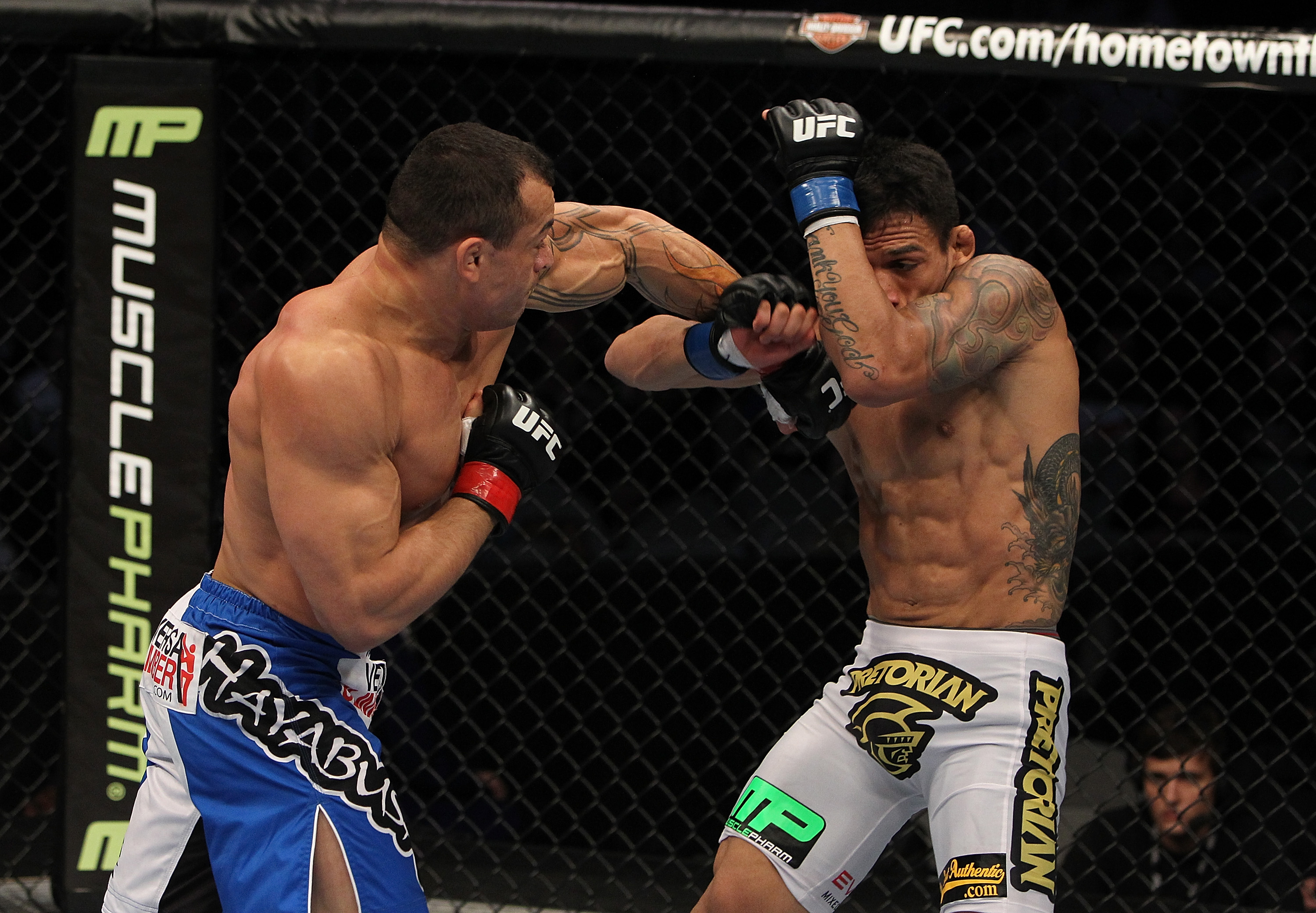 SAN JOSE, CA - NOVEMBER 19: (L-R) Gleison Tibau punches Rafael dos Anjos during an UFC Lightweight bout at the HP Pavillion in San Jose, California on November 19, 2011 in San Jose, California. (Photo by Josh Hedges/Zuffa LLC/Zuffa LLC via Getty Images)