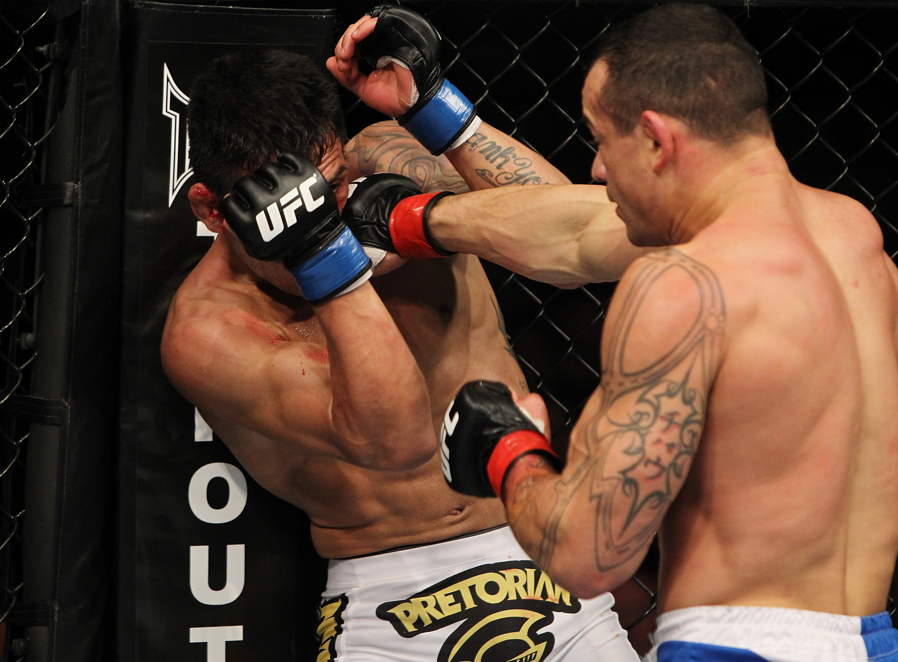 SAN JOSE, CA - NOVEMBER 19: (R-L) Gleison Tibau punches Rafael dos Anjos during an UFC Lightweight bout at the HP Pavillion in San Jose, California on November 19, 2011 in San Jose, California. (Photo by Josh Hedges/Zuffa LLC/Zuffa LLC via Getty Images)