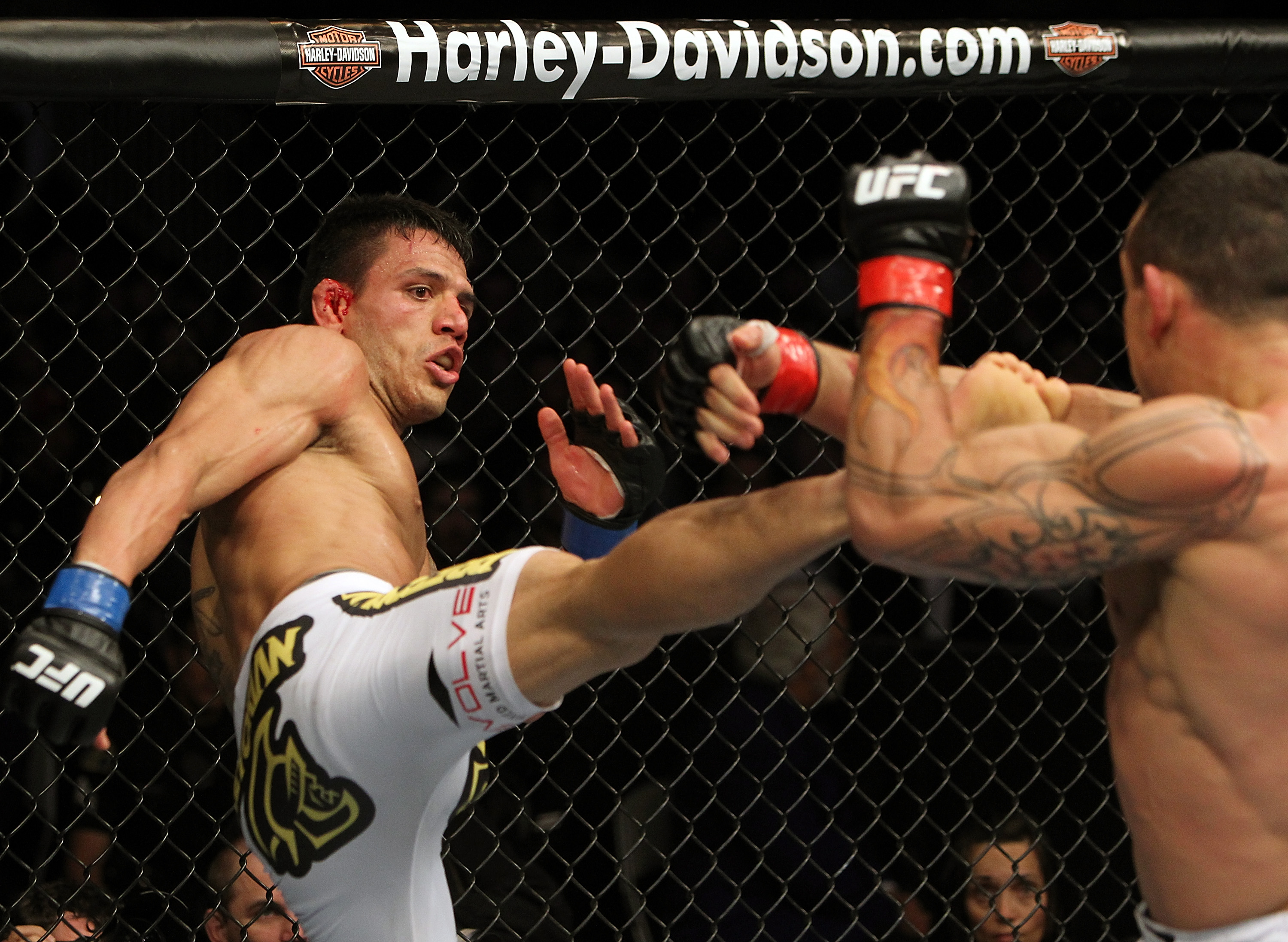 SAN JOSE, CA - NOVEMBER 19: (L-R) Rafael dos Anjos kicks Gleison Tibau during an UFC Lightweight bout at the HP Pavillion in San Jose, California on November 19, 2011 in San Jose, California. (Photo by Josh Hedges/Zuffa LLC/Zuffa LLC via Getty Images)