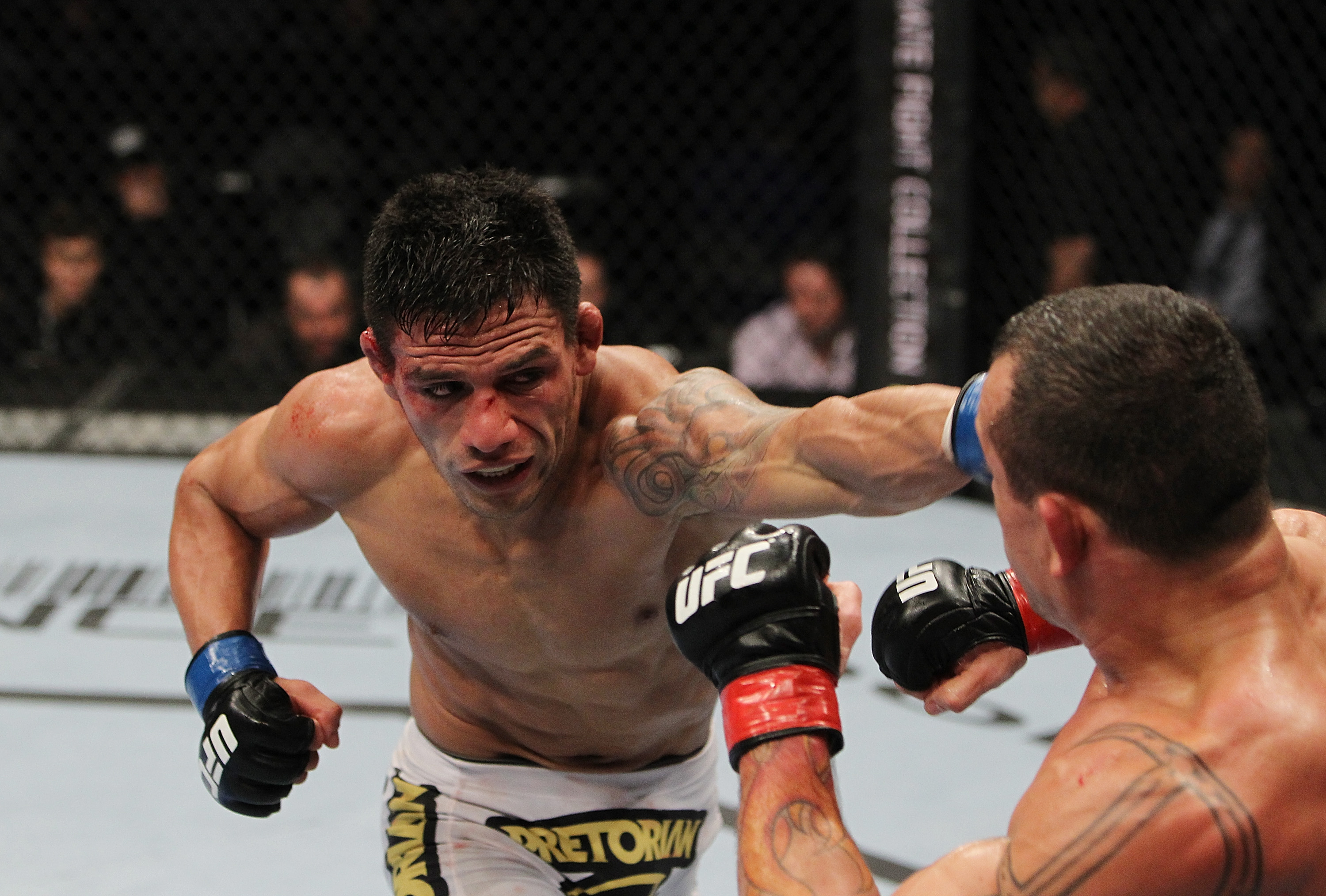 SAN JOSE, CA - NOVEMBER 19: (L-R) Rafael dos Anjos punches Gleison Tibau during an UFC Lightweight bout at the HP Pavillion in San Jose, California on November 19, 2011 in San Jose, California. (Photo by Josh Hedges/Zuffa LLC/Zuffa LLC via Getty Images)