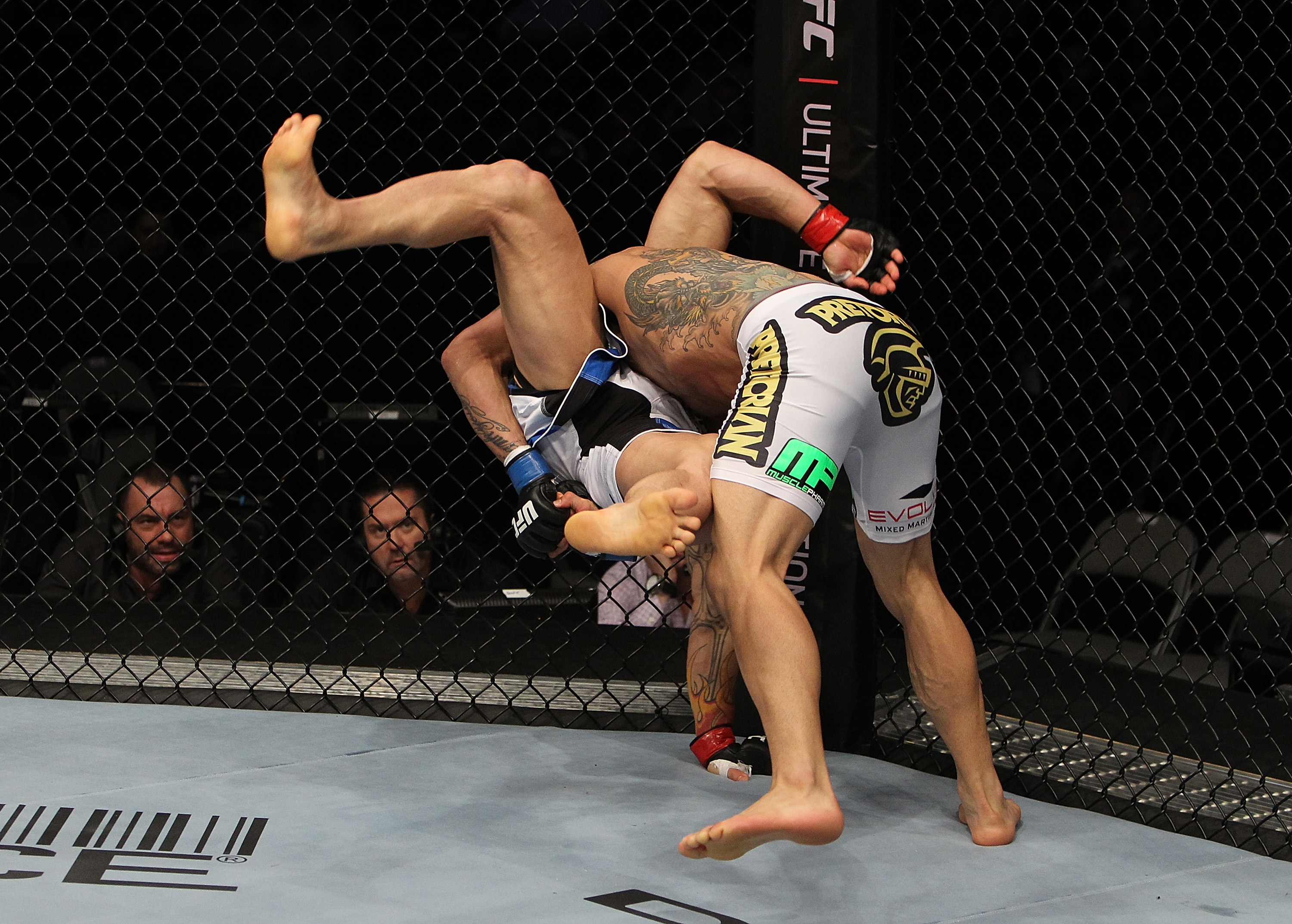 SAN JOSE, CA - NOVEMBER 19: (R-L)Rafael dos Anjos slams Gleison Tibau to the mat during an UFC Lightweight bout at the HP Pavillion in San Jose, California on November 19, 2011 in San Jose, California. (Photo by Josh Hedges/Zuffa LLC/Zuffa LLC via Getty Images)