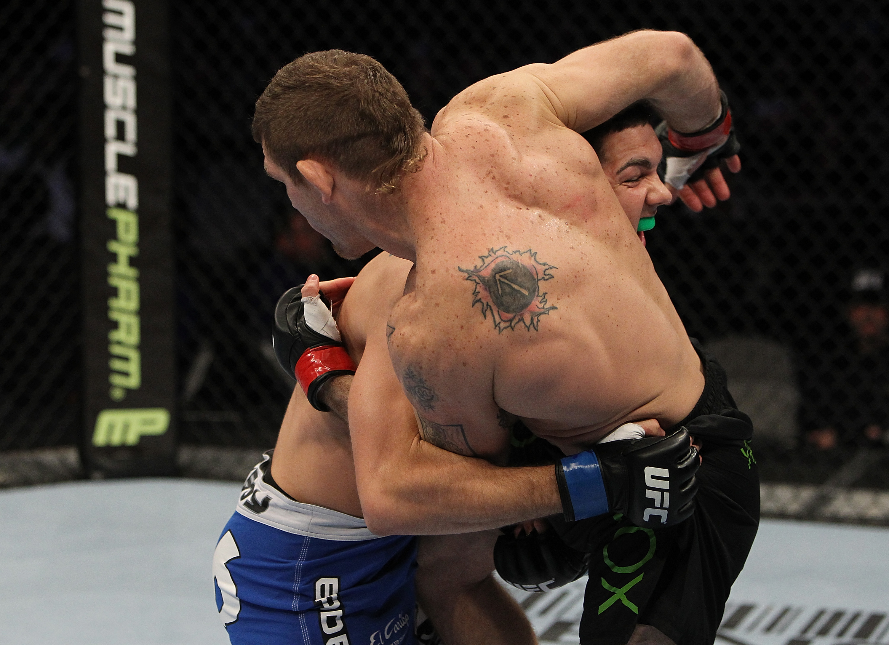 SAN JOSE, CA - NOVEMBER 19: (L-R) Chris Weidman wraps up Tom Lawlor during an UFC Middleweight bout at the HP Pavillion on November 19, 2011 in San Jose, California. (Photo by Josh Hedges/Zuffa LLC/Zuffa LLC via Getty Images)