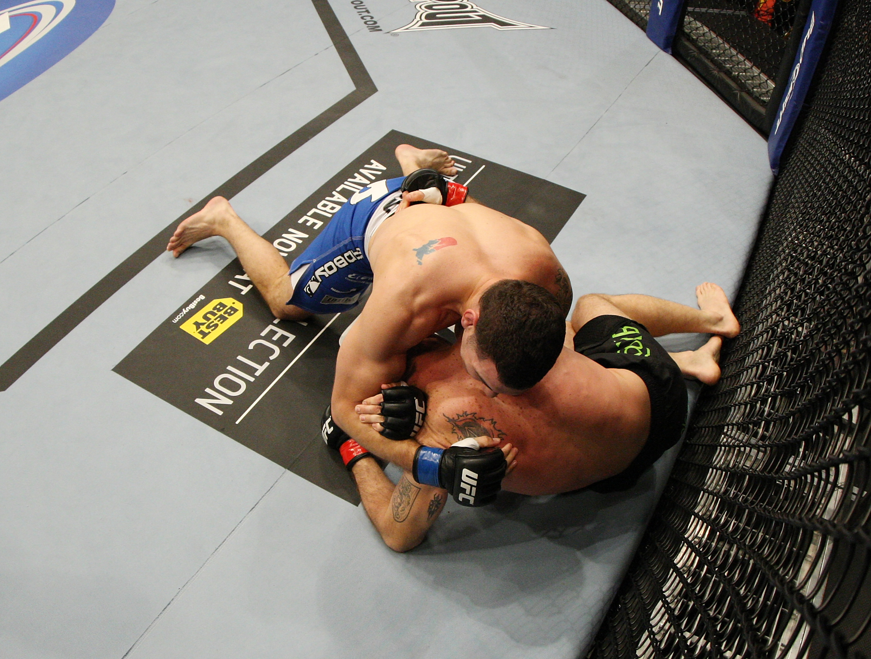 SAN JOSE, CA - NOVEMBER 19: Chris Weidman with a choke hold takes Tom Lawlor to the mat during an UFC Middleweight bout at the HP Pavillion on November 19, 2011 in San Jose, California. (Photo by Josh Hedges/Zuffa LLC/Zuffa LLC via Getty Images)