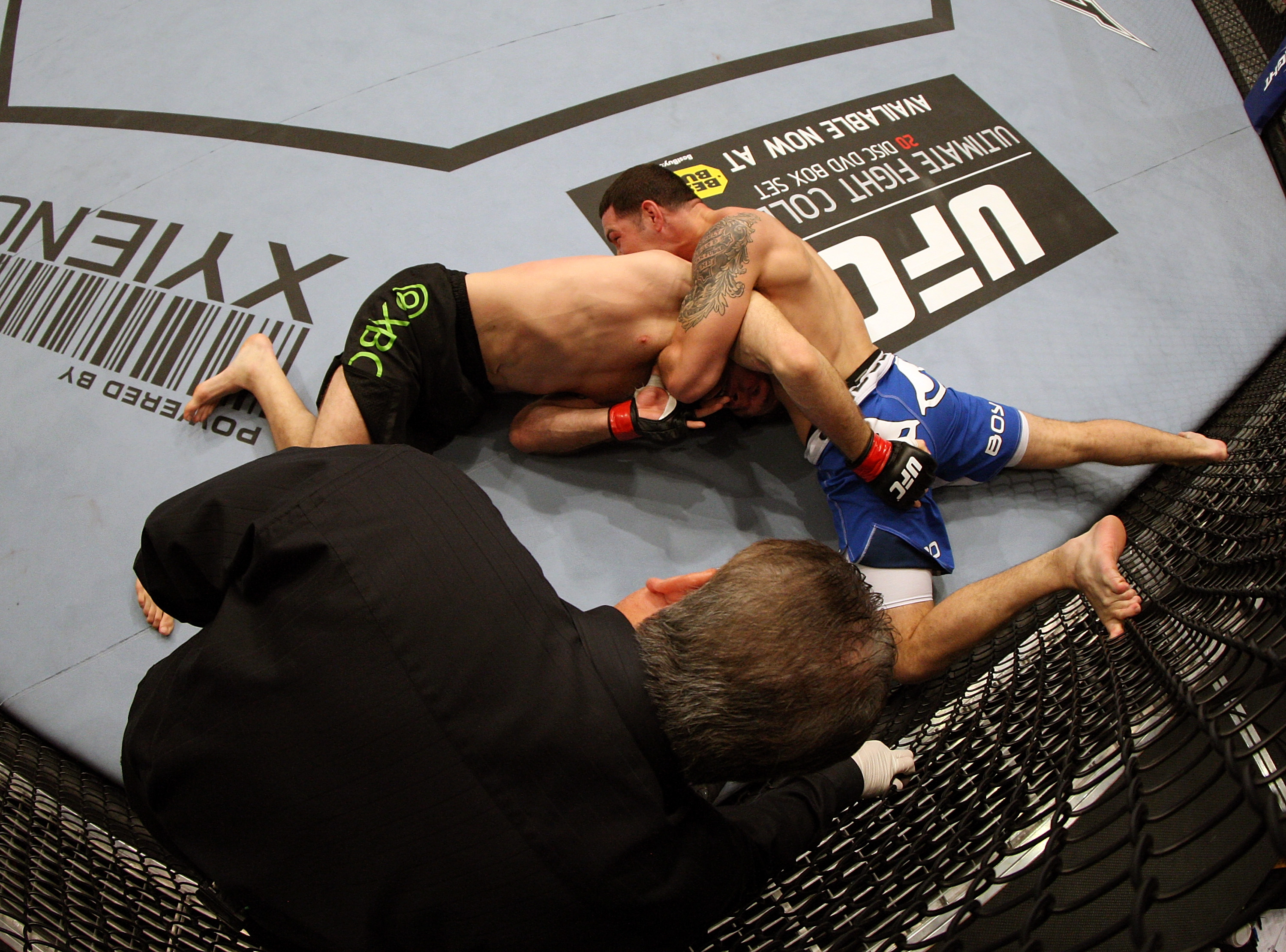 SAN JOSE, CA - NOVEMBER 19: Chris Weidman with a choke hold takes Tom Lawlor to the mat during an UFC Middleweight bout at the HP Pavillion on November 19, 2011 in San Jose, California. (Photo by Josh Hedges/Zuffa LLC/Zuffa LLC via Getty Images)