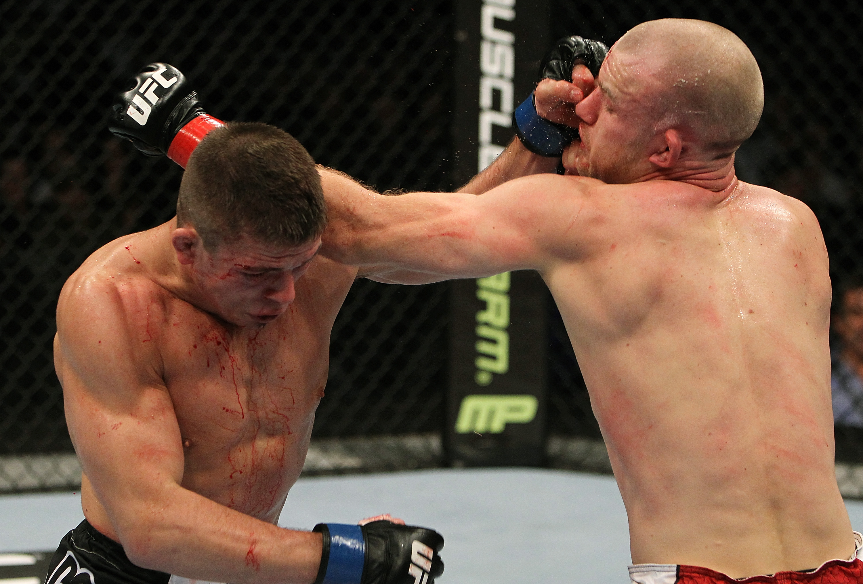 SAN JOSE, CA - NOVEMBER 19: (R-L) Martin Kampmann and Rick Story exchange punches during an UFC Welterweight bout at the HP Pavillion on November 19, 2011 in San Jose, California. (Photo by Josh Hedges/Zuffa LLC/Zuffa LLC via Getty Images)