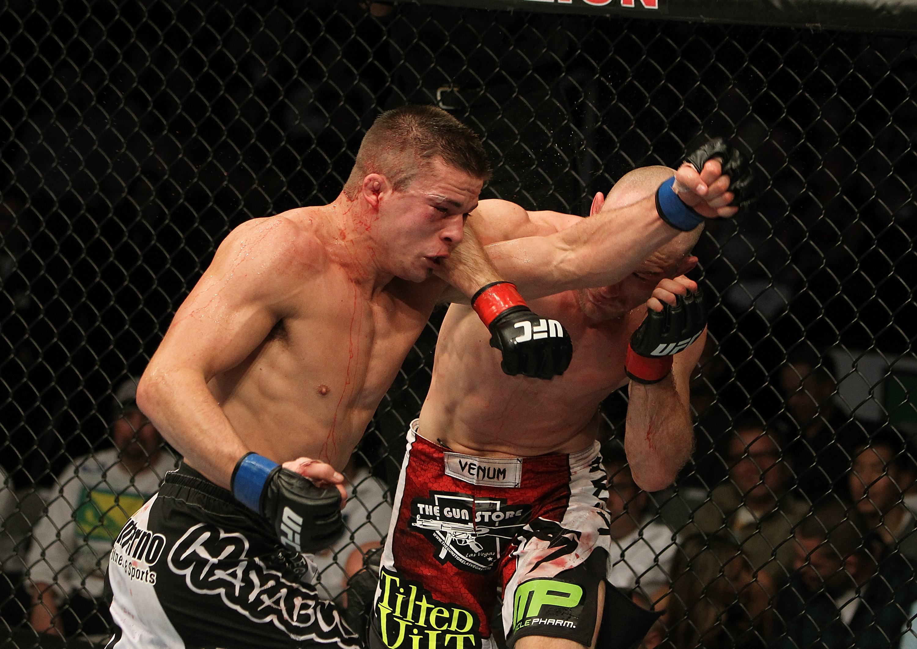 SAN JOSE, CA - NOVEMBER 19: (R-L) Martin Kampmann punches Rick Story during an UFC Welterweight bout at the HP Pavillion on November 19, 2011 in San Jose, California. (Photo by Josh Hedges/Zuffa LLC/Zuffa LLC via Getty Images)