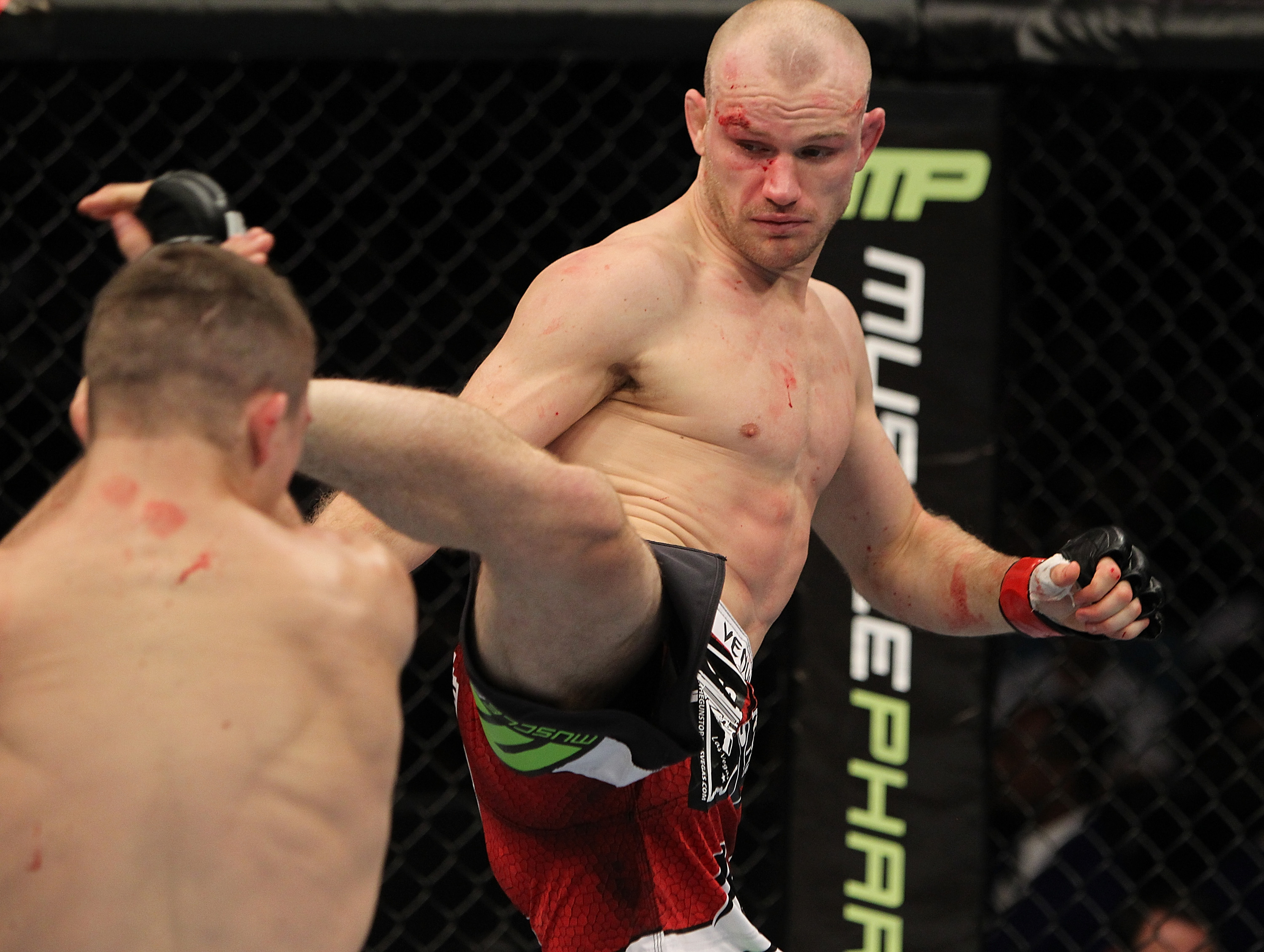 SAN JOSE, CA - NOVEMBER 19: (R-L) Martin Kampmann kicks Rick Story during an UFC Welterweight bout at the HP Pavillion on November 19, 2011 in San Jose, California. (Photo by Josh Hedges/Zuffa LLC/Zuffa LLC via Getty Images)