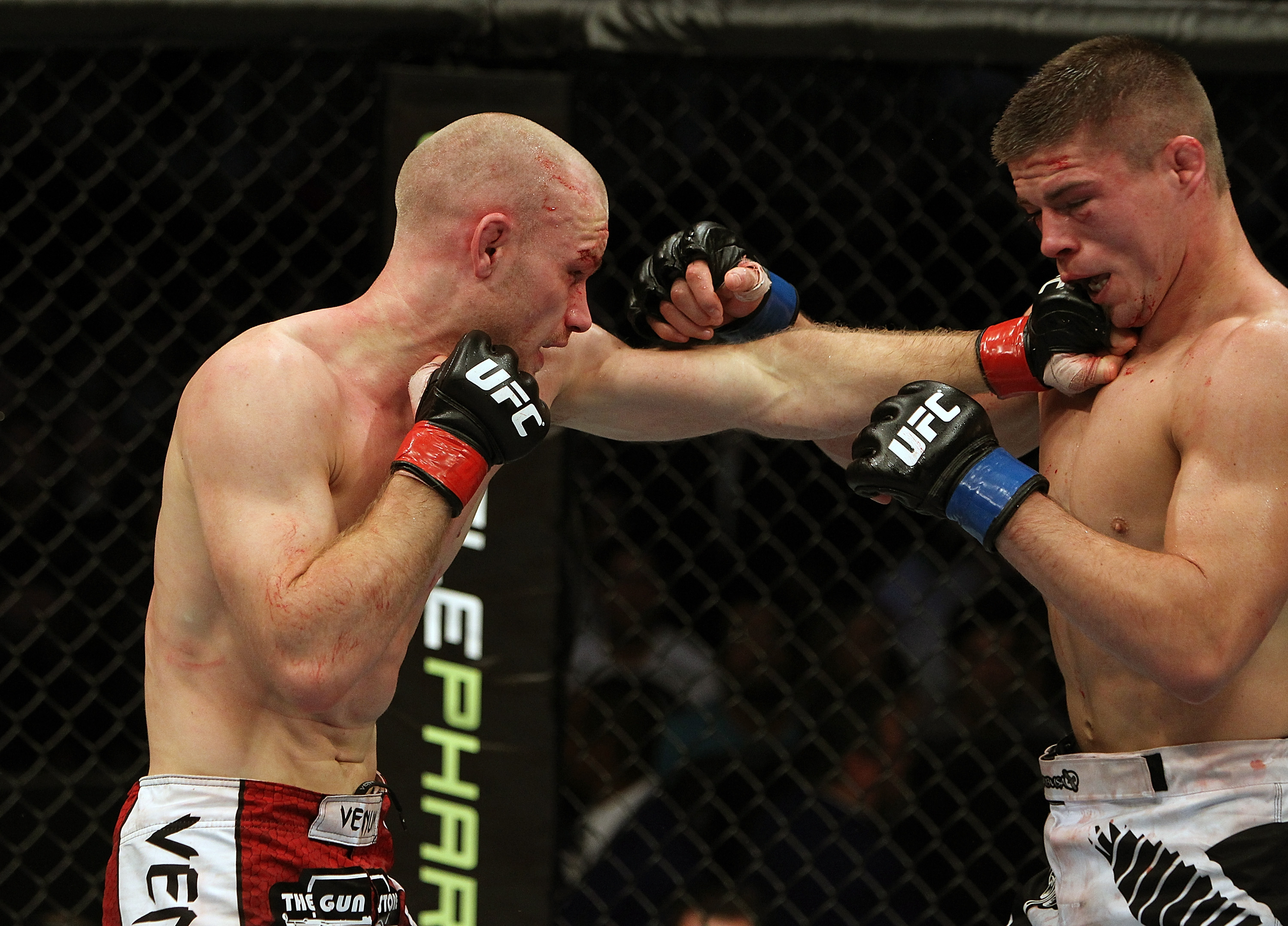 SAN JOSE, CA - NOVEMBER 19: (L-R) Martin Kampmann punches Rick Story during an UFC Welterweight bout at the HP Pavillion on November 19, 2011 in San Jose, California. (Photo by Josh Hedges/Zuffa LLC/Zuffa LLC via Getty Images)