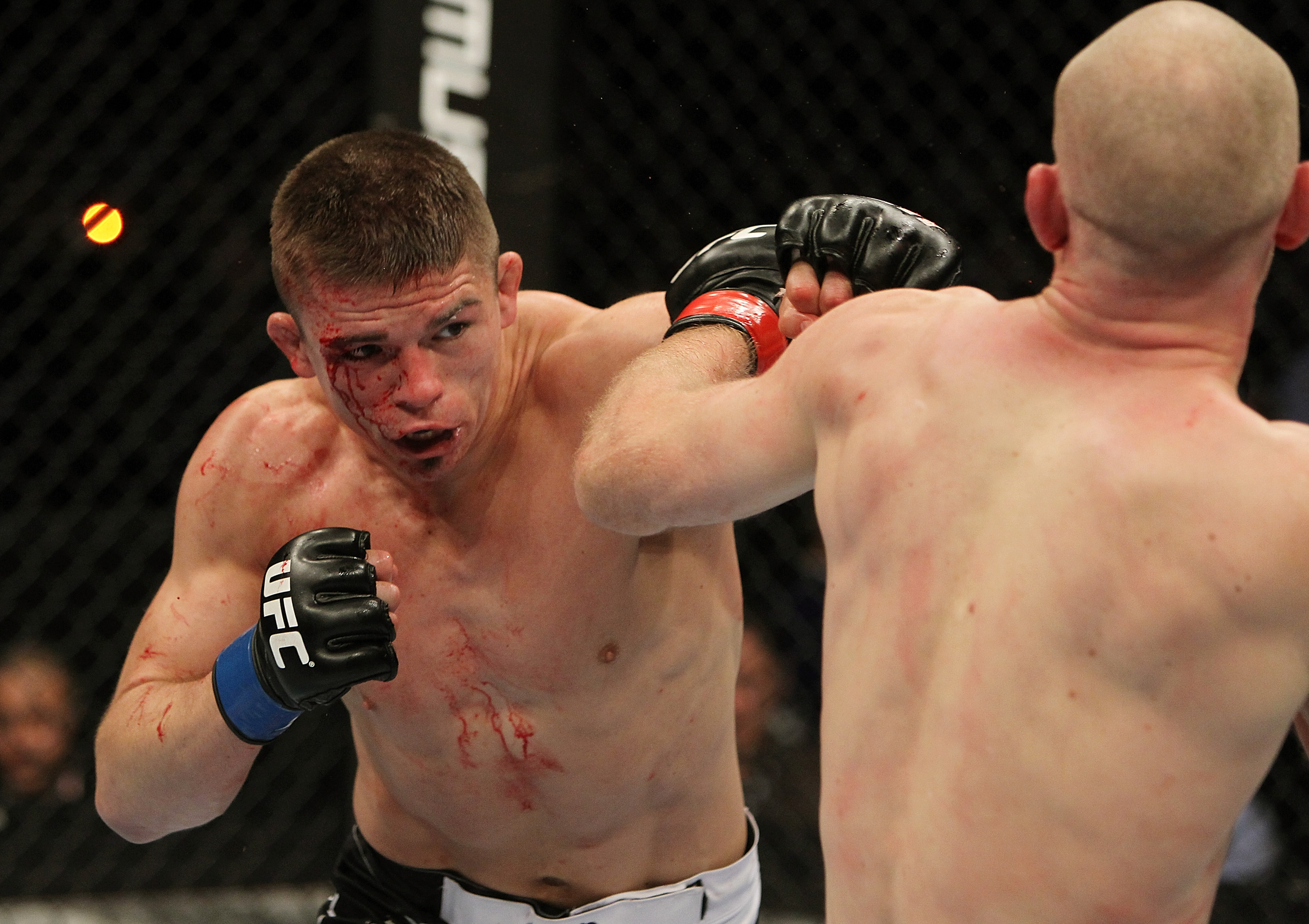 SAN JOSE, CA - NOVEMBER 19: (R-L) Rick Story punches Martin Kampmann during an UFC Welterweight bout at the HP Pavilion on November 19, 2011 in San Jose, California. (Photo by Josh Hedges/Zuffa LLC/Zuffa LLC via Getty Images)