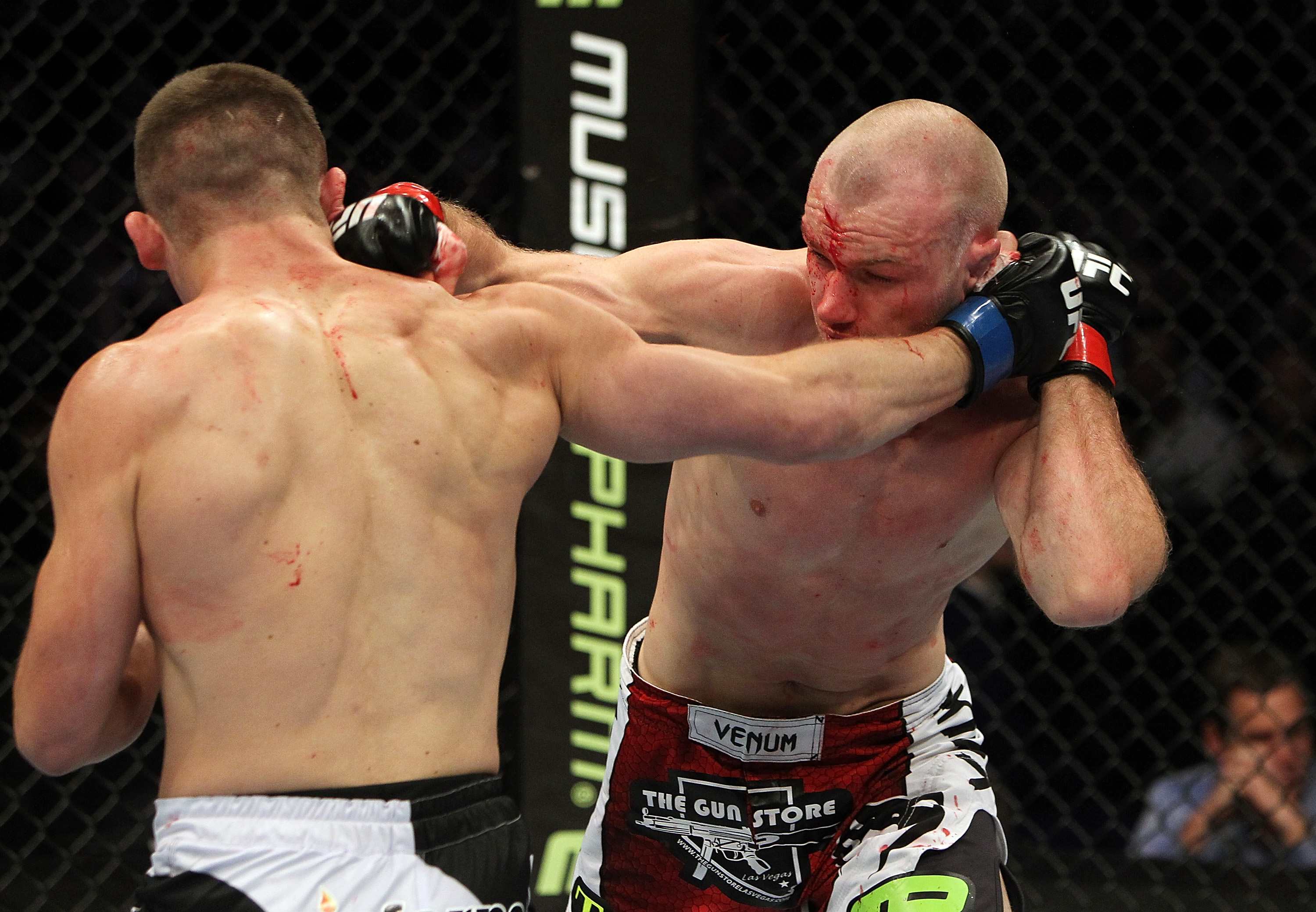 SAN JOSE, CA - NOVEMBER 19: Rick Story and Martin Kampmann exchange punches during an UFC Light Heavywieght bout at the HP Pavilion on November 19, 2011 in San Jose, California. (Photo by Josh Hedges/Zuffa LLC/Zuffa LLC via Getty Images)