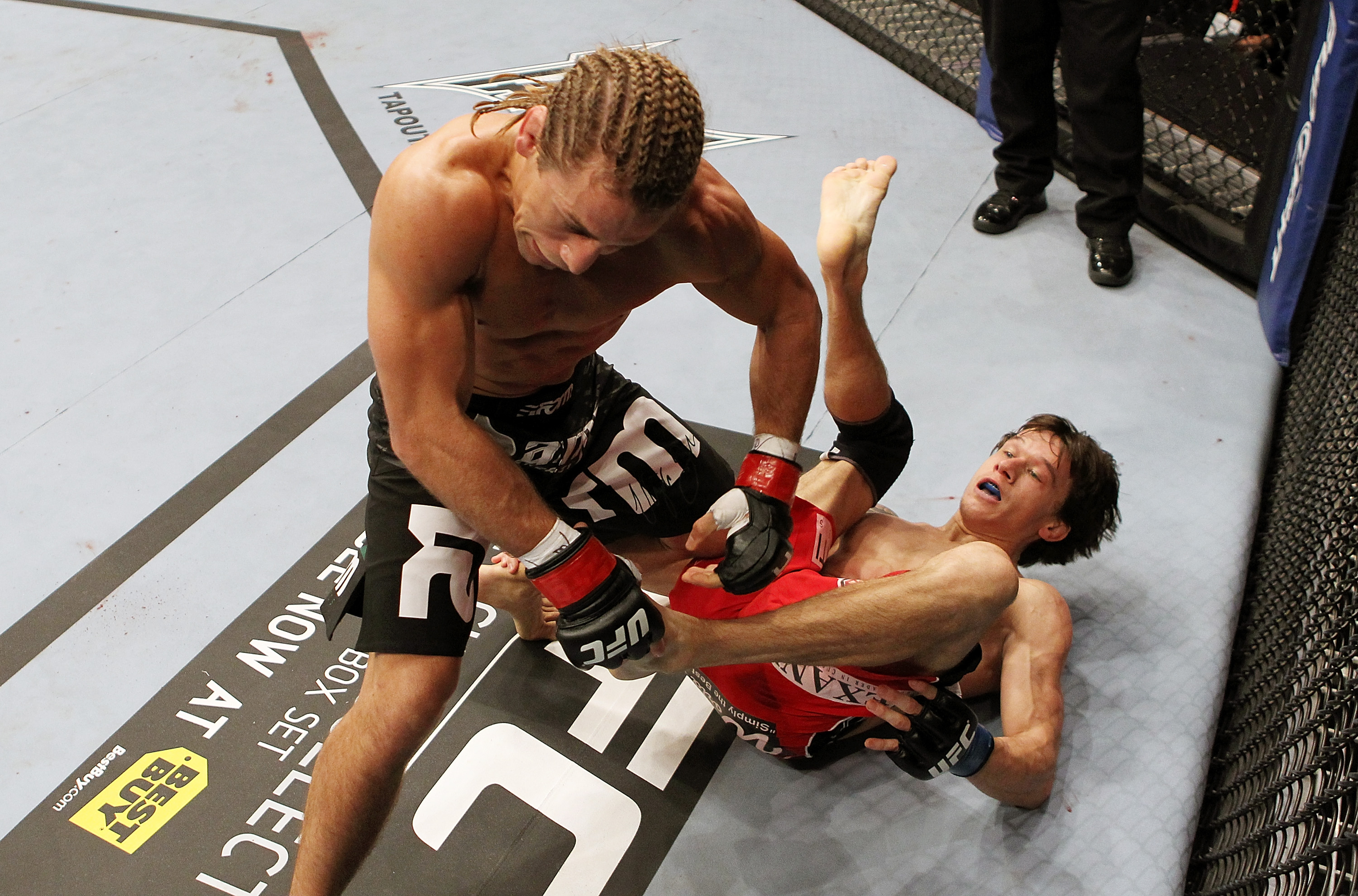SAN JOSE, CA - NOVEMBER 19: (R-L) Brian Bowles kicks Urijah Faber during an UFC Bantamweight bout at the HP Pavillion on November 19, 2011 in San Jose, California. (Photo by Josh Hedges/Zuffa LLC/Zuffa LLC via Getty Images)