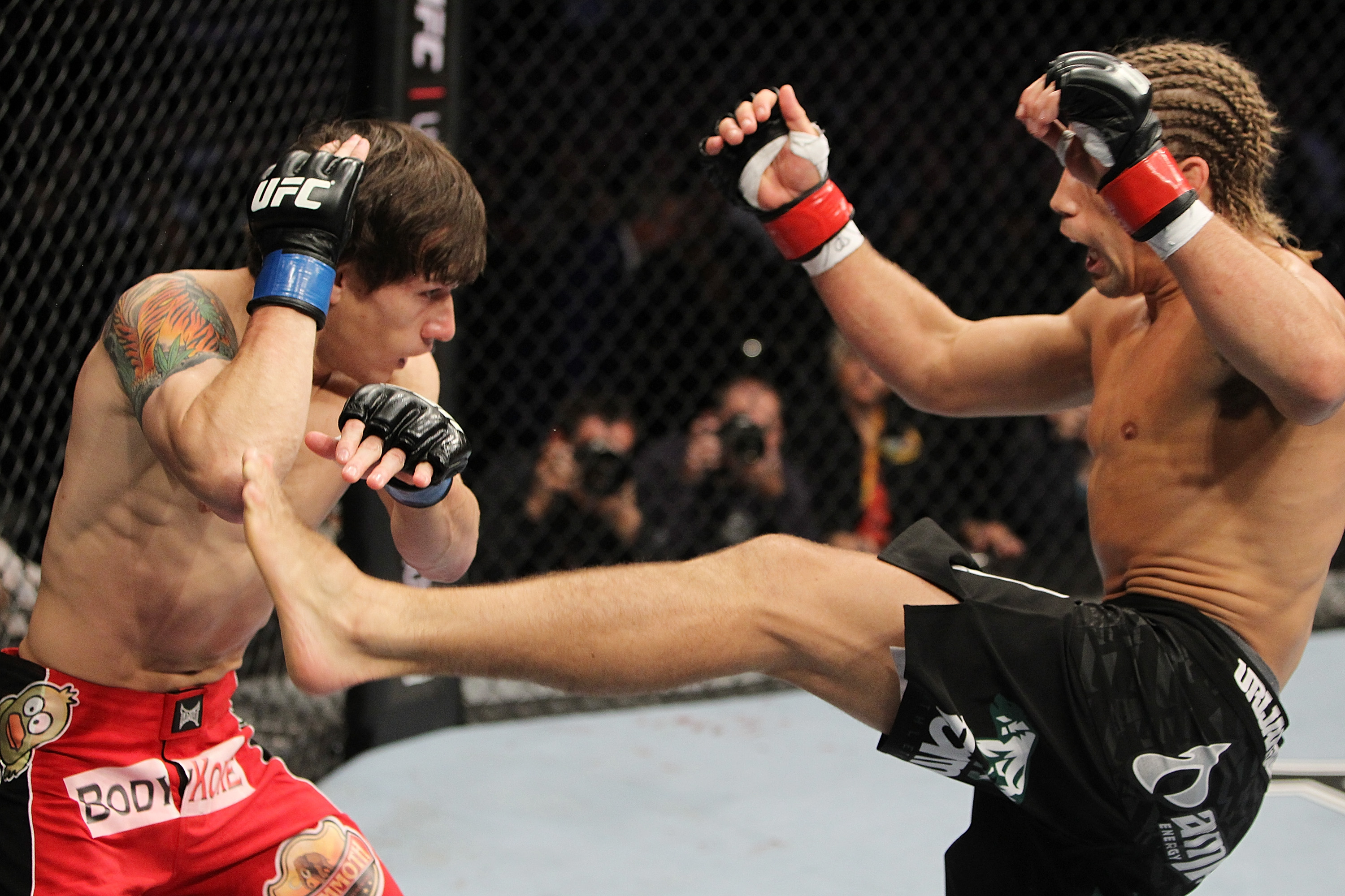 SAN JOSE, CA - NOVEMBER 19: (R-L) Urijah Faber kicks Brian Bowles during an UFC Bantamweight bout at the HP Pavillion on November 19, 2011 in San Jose, California. (Photo by Josh Hedges/Zuffa LLC/Zuffa LLC via Getty Images)