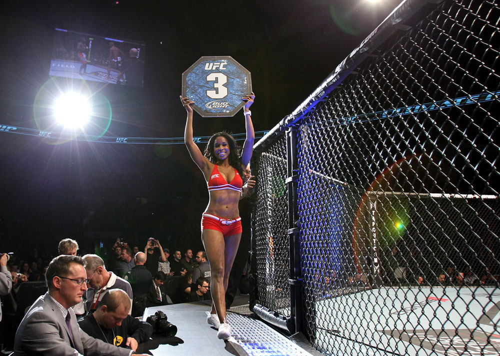 TORONTO, ON - DECEMBER 10: UFC Octagon Girl Chandella Powell introduces round three during the Watson v Jabouin bout during the UFC 140 event at Air Canada Centre on December 10, 2011 in Toronto, Canada. (Photo by Josh Hedges/Zuffa LLC/Zuffa LLC via Getty Images)