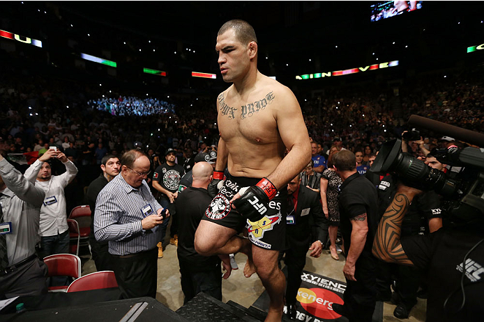 HOUSTON, TEXAS - OCTOBER 19:  Cain Velasquez enters the Octagon before facing Junior Dos Santos (not pictured) in their UFC heavyweight championship bout at the Toyota Center on October 19, 2013 in Houston, Texas. (Photo by Nick Laham/Zuffa LLC/Zuffa LLC via Getty Images)