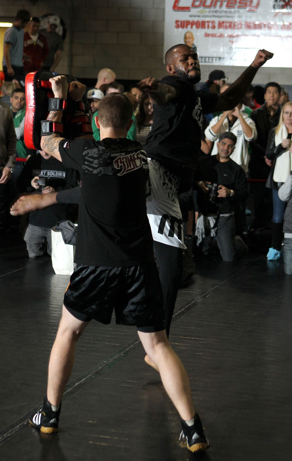 TORONTO, ON - DECEMBER 07:  UFC Light Heavyweight Champion Jon "Bones" Jones works out for the fans and media during the UFC 140 Open Workouts at the Xtreme Couture Gym on December 7, 2011 in Toronto, Ontario.  (Photo by Josh Hedges/Zuffa LLC/Zuffa LLC via Getty Images)