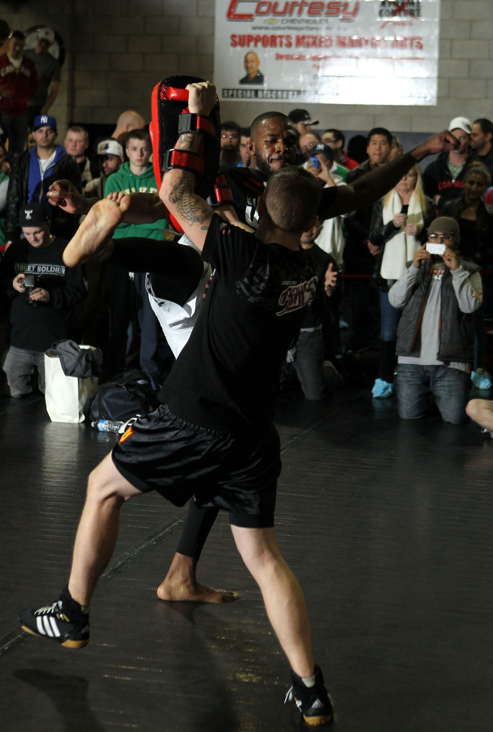 TORONTO, ON - DECEMBER 07:  UFC Light Heavyweight Champion Jon "Bones" Jones works out for the fans and media during the UFC 140 Open Workouts at the Xtreme Couture Gym on December 7, 2011 in Toronto, Ontario.  (Photo by Josh Hedges/Zuffa LLC/Zuffa LLC via Getty Images)