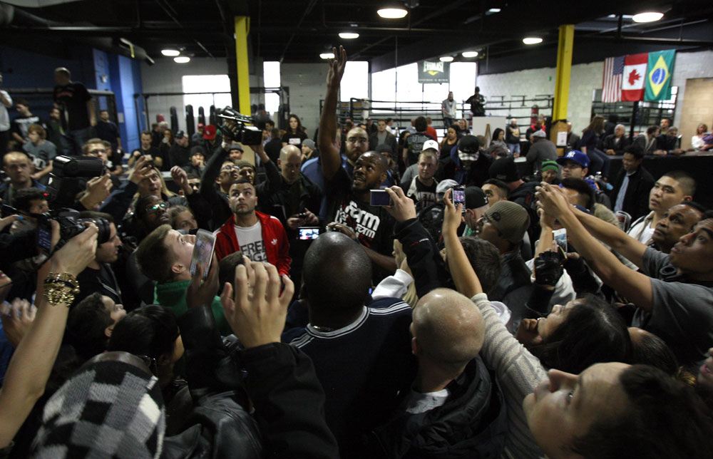 TORONTO, ON - DECEMBER 07:  UFC Light Heavyweight Champion Jon "Bones" Jones signs autographs for fans during the UFC 140 Open Workouts at the Xtreme Couture Gym on December 7, 2011 in Toronto, Ontario.  (Photo by Josh Hedges/Zuffa LLC/Zuffa LLC via Getty Images)