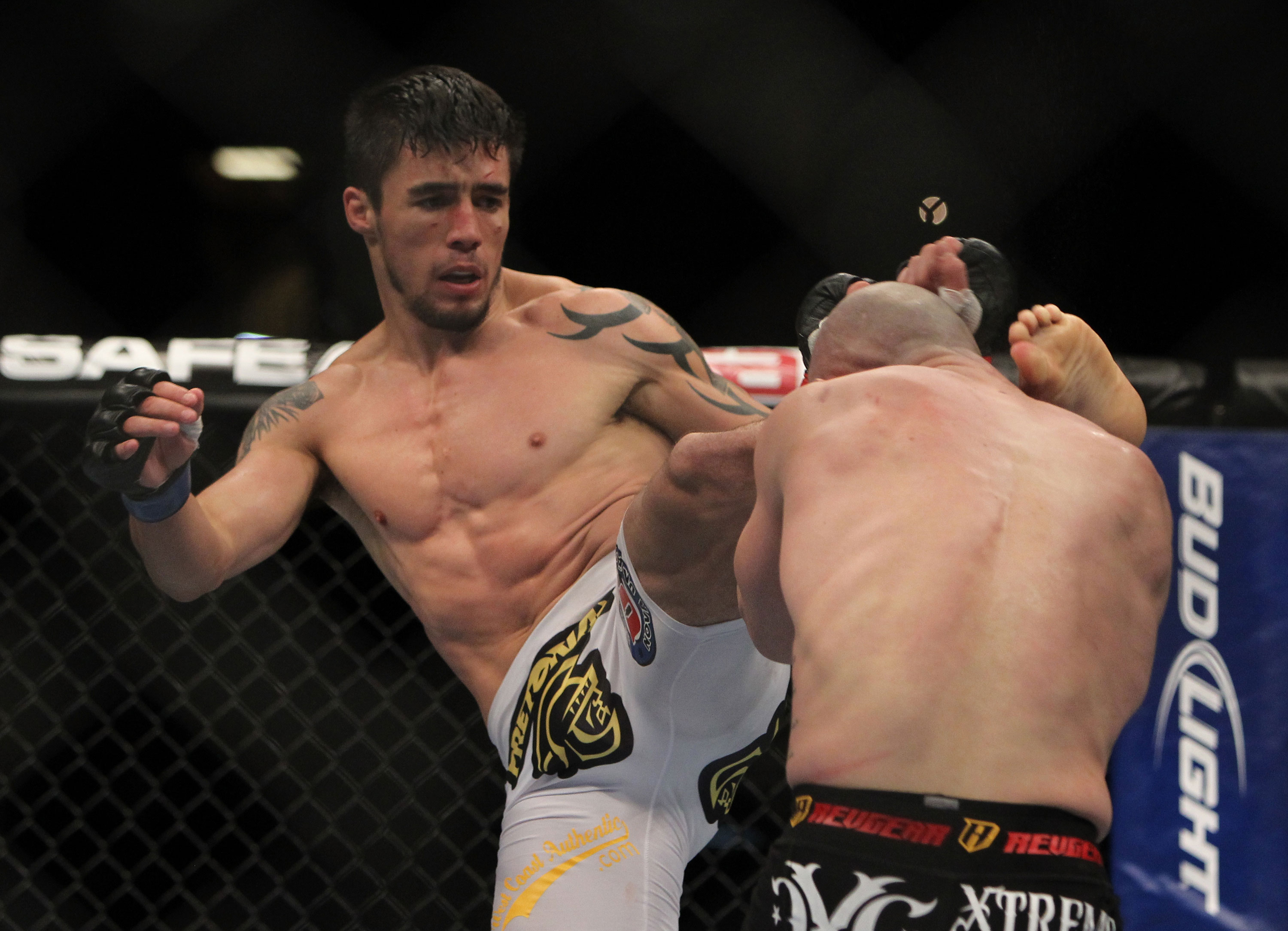 LAS VEGAS, NV - DECEMBER 30: Diego Nunes (left) kicks Manny Gamburyan (right) during the UFC 141 event at the MGM Grand Garden Arena on December 30, 2011 in Las Vegas, Nevada. (Photo by Josh Hedges/Zuffa LLC/Zuffa LLC via Getty Images) *** Local Caption *** Diego Nunes; Manny Gamburyan