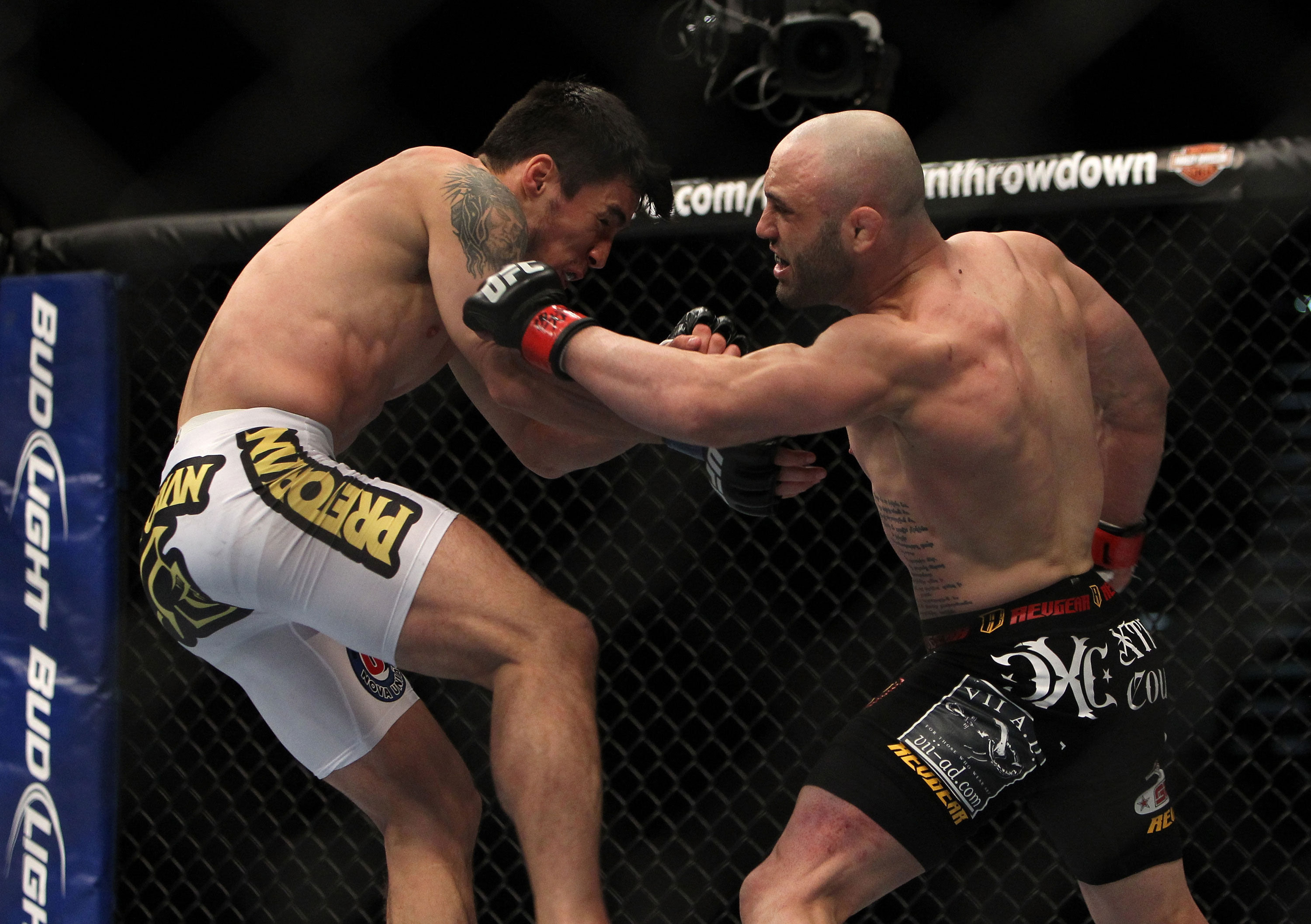 LAS VEGAS, NV - DECEMBER 30: Manny Gamburyan (right) punches Diego Nunes (left) during the UFC 141 event at the MGM Grand Garden Arena on December 30, 2011 in Las Vegas, Nevada. (Photo by Josh Hedges/Zuffa LLC/Zuffa LLC via Getty Images) *** Local Caption *** Manny Gamburyan; Diego Nunes