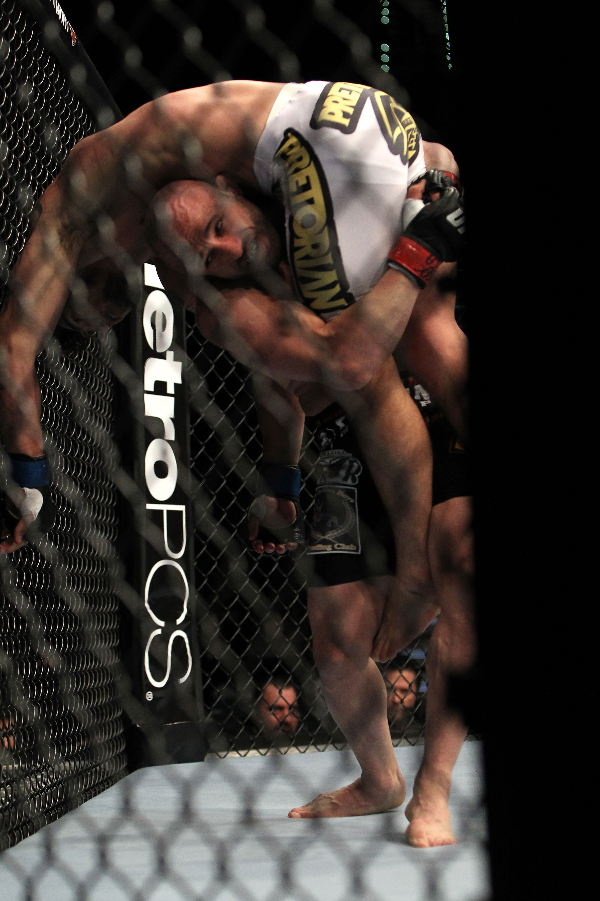 LAS VEGAS, NV - DECEMBER 30: Manny Gamburyan (black shorts) lifts Diego Nunes (white shorts) up for a takedown during the UFC 141 event at the MGM Grand Garden Arena on December 30, 2011 in Las Vegas, Nevada. (Photo by Josh Hedges/Zuffa LLC/Zuffa LLC via Getty Images) *** Local Caption *** Manny Gamburyan; Diego Nunes