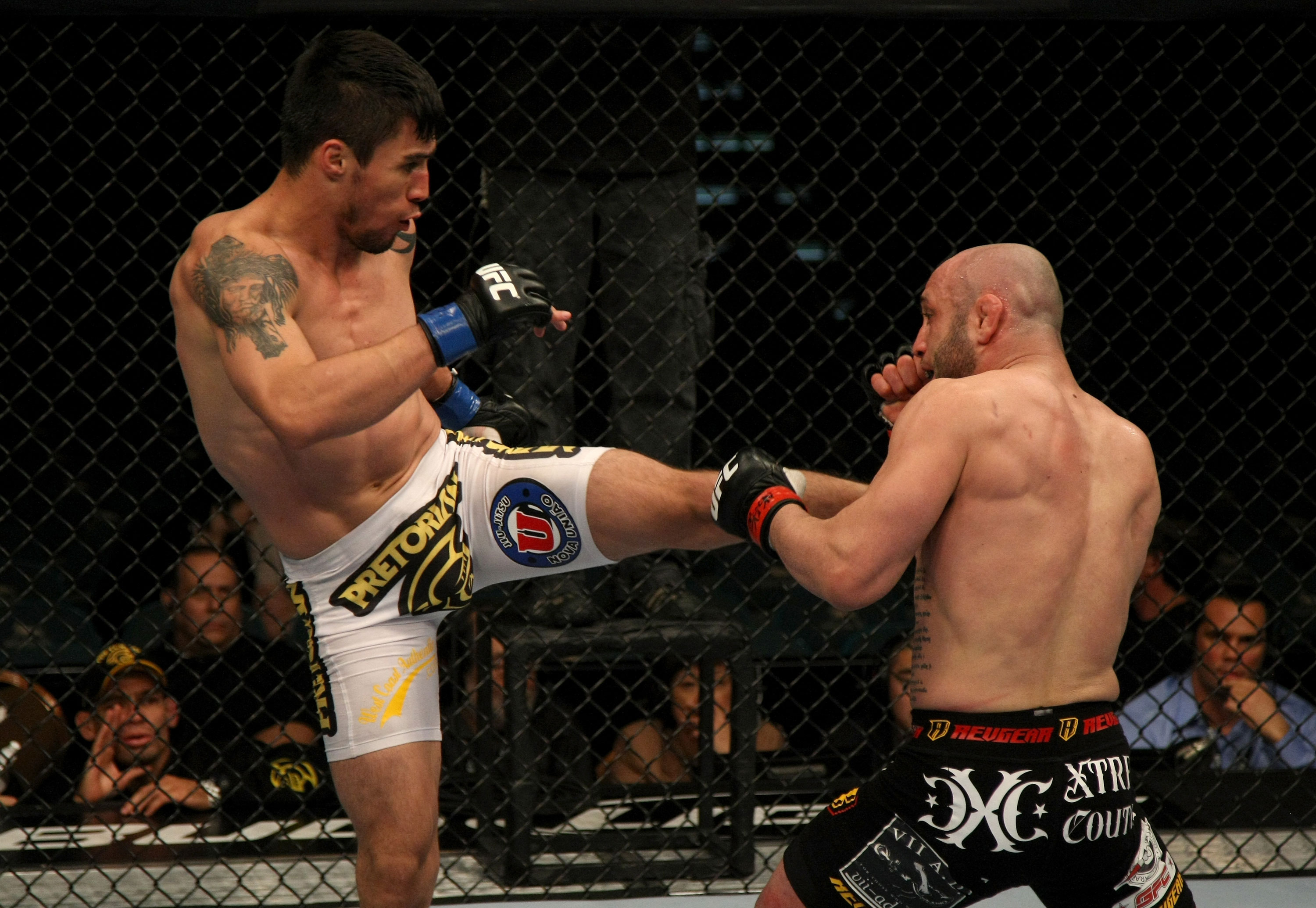 LAS VEGAS, NV - DECEMBER 30: Diego Nunes (left) kicks Manny Gamburyan (right) during the UFC 141 event at the MGM Grand Garden Arena on December 30, 2011 in Las Vegas, Nevada. (Photo by Donald Miralle/Zuffa LLC/Zuffa LLC via Getty Images) *** Local Caption *** Diego Nunes; Manny Gamburyan