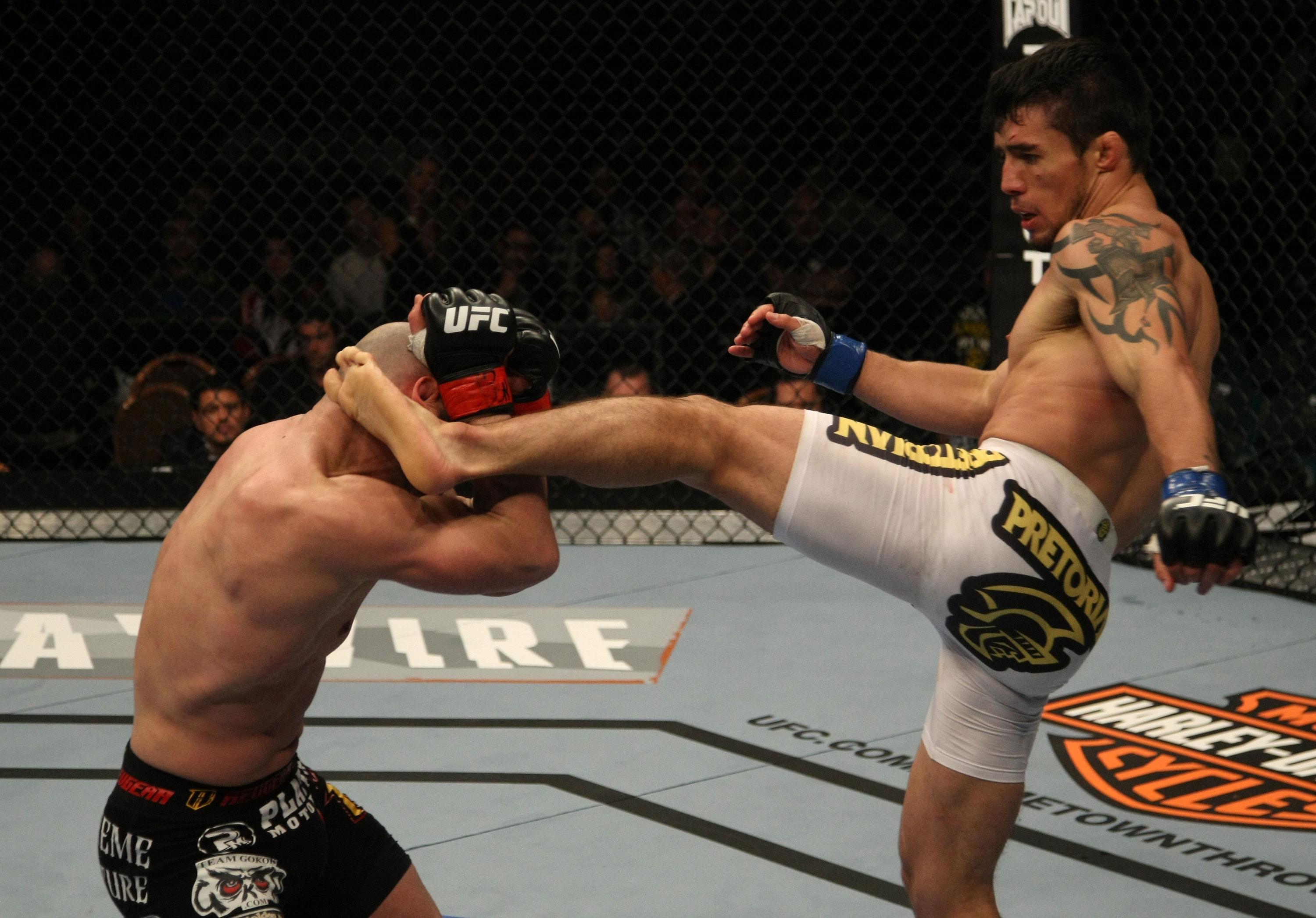 LAS VEGAS, NV - DECEMBER 30: Diego Nunes (right) throws a headkick at Manny Gamburyan (left) during the UFC 141 event at the MGM Grand Garden Arena on December 30, 2011 in Las Vegas, Nevada. (Photo by Donald Miralle/Zuffa LLC/Zuffa LLC via Getty Images) *** Local Caption *** Diego Nunes; Manny Gamburyan