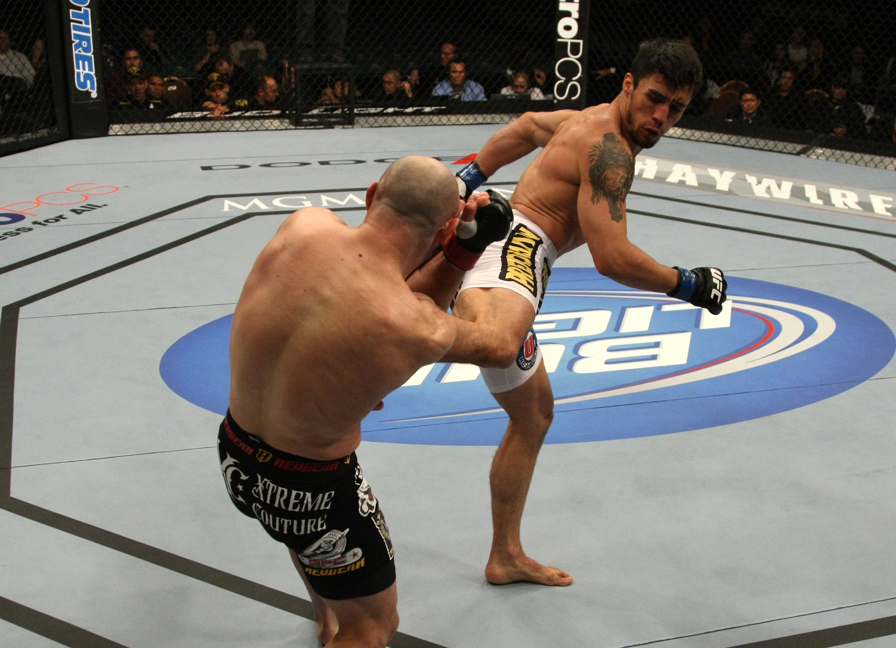 LAS VEGAS, NV - DECEMBER 30: Diego Nunes (white shorts) kicks Manny Gamburyan (black shorts) during the UFC 141 event at the MGM Grand Garden Arena on December 30, 2011 in Las Vegas, Nevada. (Photo by Donald Miralle/Zuffa LLC/Zuffa LLC via Getty Images) *** Local Caption *** Manny Gamburyan; Diego Nunes