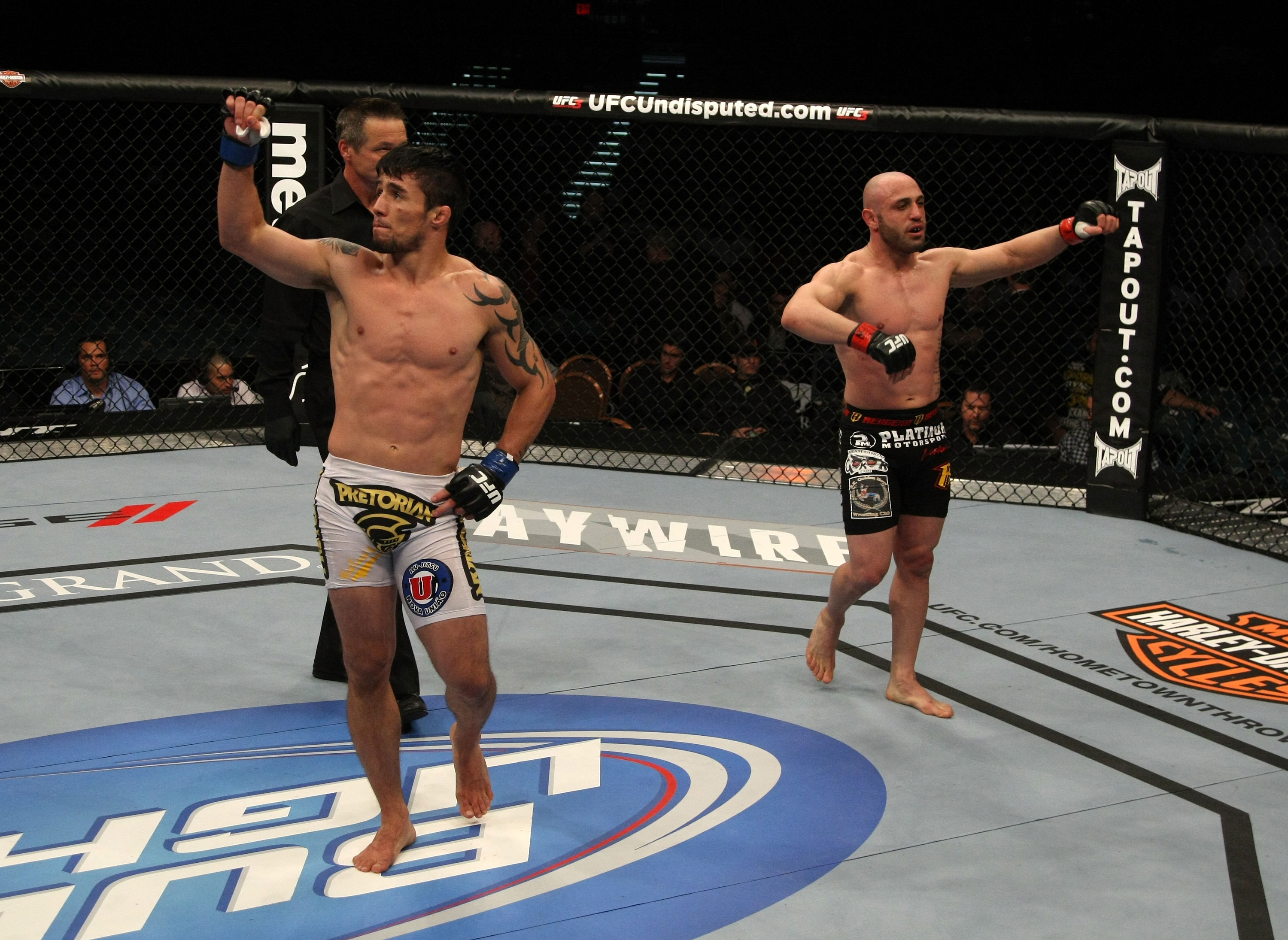 LAS VEGAS, NV - DECEMBER 30: Diego Nunes (white) and Manny Gamburyan (black) acknowledge the crowd after their fight during the UFC 141 event at the MGM Grand Garden Arena on December 30, 2011 in Las Vegas, Nevada. (Photo by Donald Miralle/Zuffa LLC/Zuffa LLC via Getty Images) *** Local Caption *** Diego Nunes; Manny Gamburyan