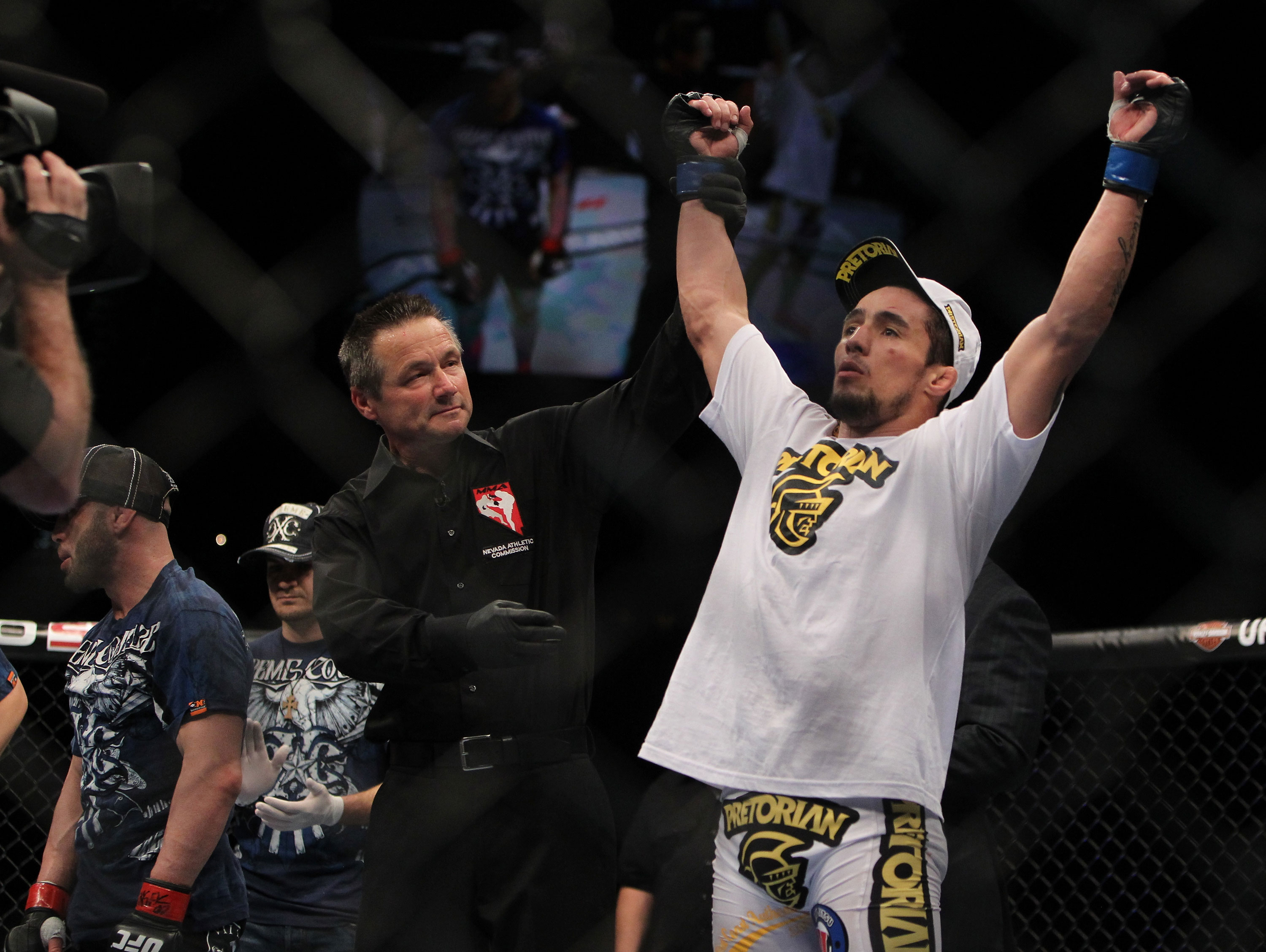 LAS VEGAS, NV - DECEMBER 30: Diego Nunes is declared the winner in his bout against Manny Gamburyan during the UFC 141 event at the MGM Grand Garden Arena on December 30, 2011 in Las Vegas, Nevada. (Photo by Josh Hedges/Zuffa LLC/Zuffa LLC via Getty Images) *** Local Caption *** Diego Nunes