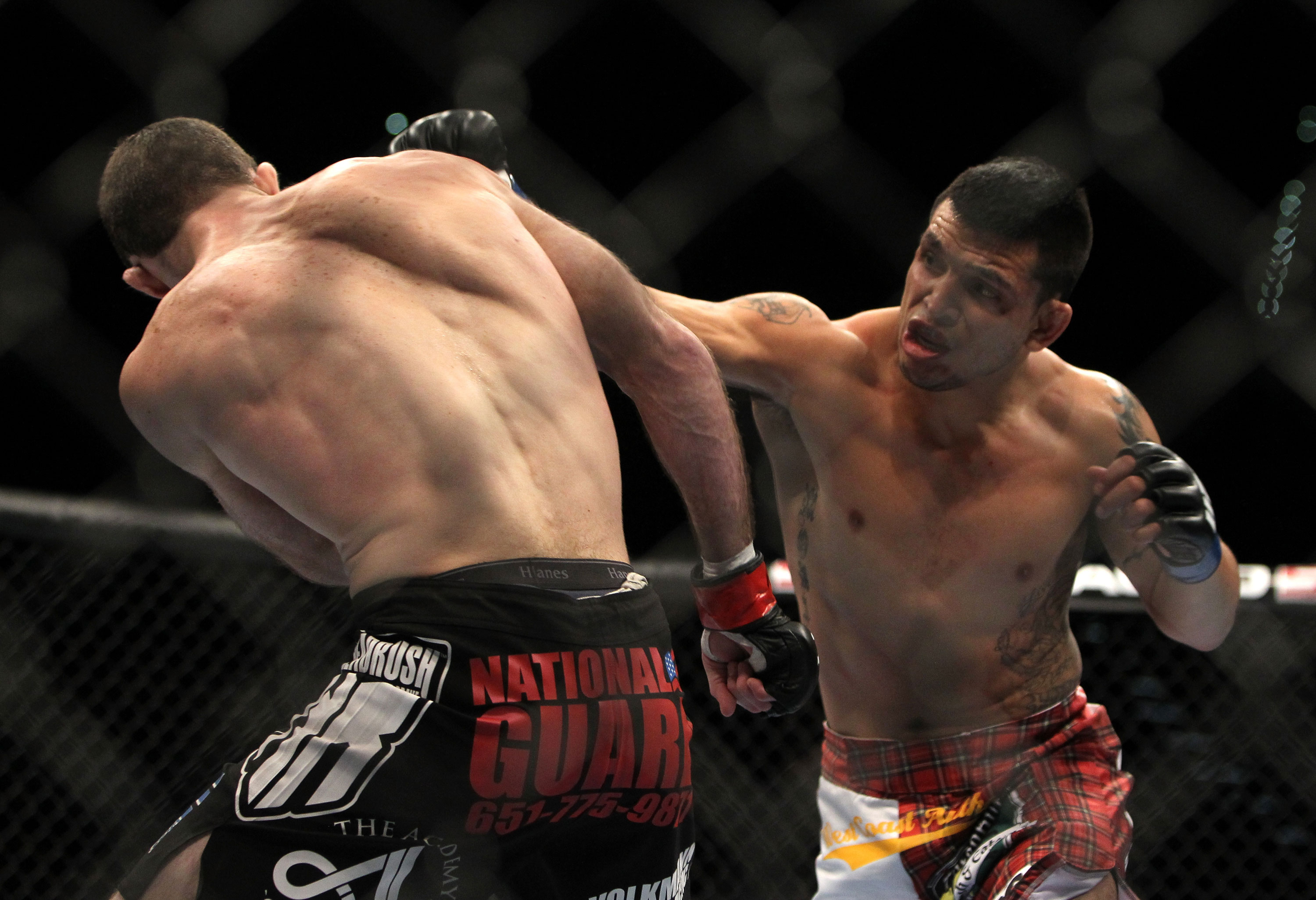 LAS VEGAS, NV - DECEMBER 30: Efrain Escudero (right) punches Jacob Volkmann during the UFC 141 event at the MGM Grand Garden Arena on December 30, 2011 in Las Vegas, Nevada. (Photo by Josh Hedges/Zuffa LLC/Zuffa LLC via Getty Images) *** Local Caption *** Efrain Escudero; Jacob Volkmann