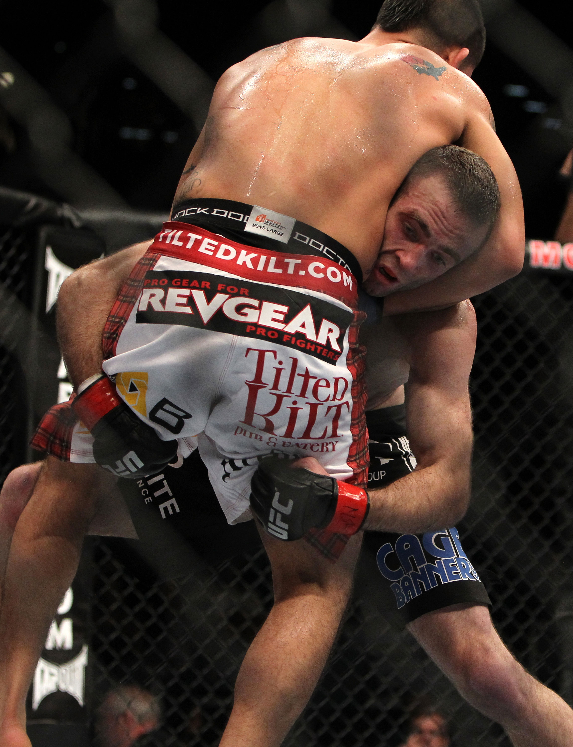 LAS VEGAS, NV - DECEMBER 30: Jacob Volkmann (black shorts) attempts to take down Efrain Escudero (white shorts) during the UFC 141 event at the MGM Grand Garden Arena on December 30, 2011 in Las Vegas, Nevada. (Photo by Josh Hedges/Zuffa LLC/Zuffa LLC via Getty Images) *** Local Caption *** Efrain Escudero; Jacob Volkmann